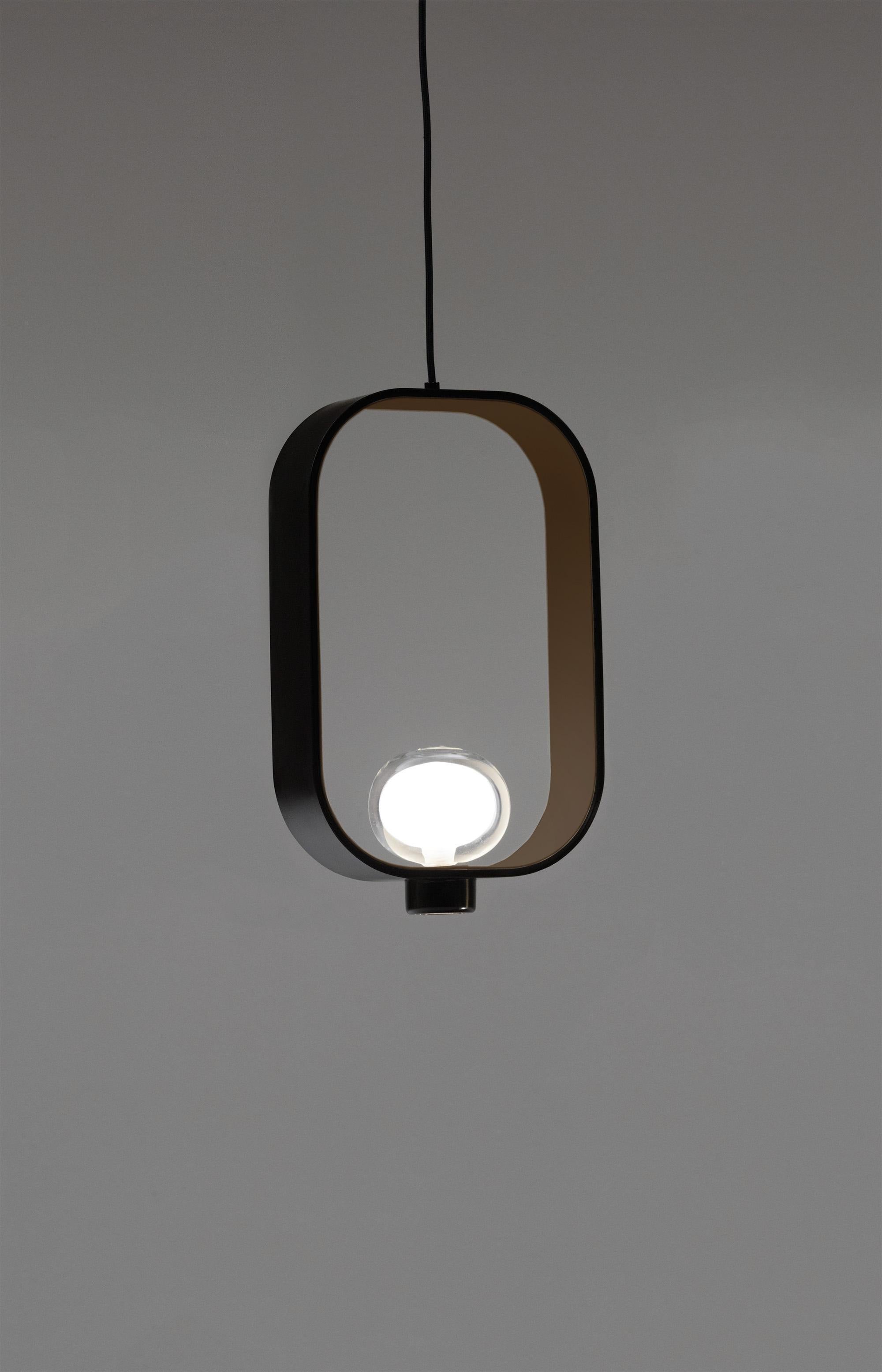 Inspired by the classic Chinese lanterns, the particular bi-dimensional structure is made by powder coated painted metal on the outside, while the inside color is sand grey. The light source is located inside a double-side borosilicate glass