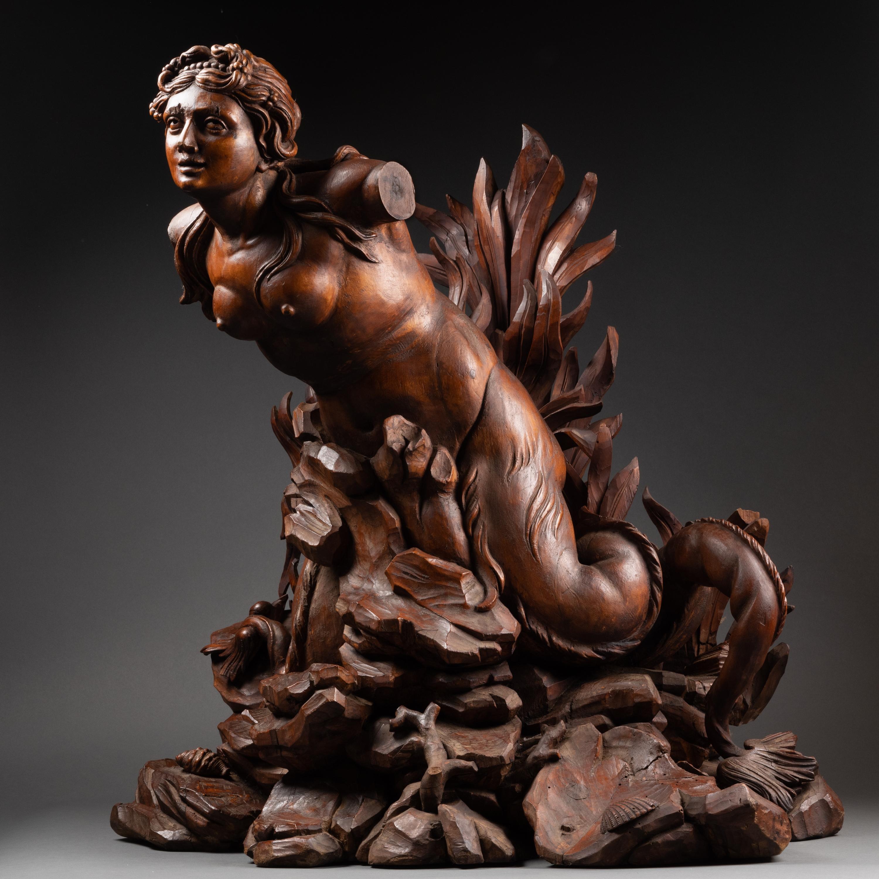 A late 17th c. Italian carved figure of Mermaid, 
Circle of Filippo Parodi  (Genoa, 1630 – July 22, 1702) 
Dimensions: h. 29.13 in, w. 30.31 in, p. 18.9 in (at the base)

Magnificent Italian Baroque sculpture depicting a mermaid seated on the
