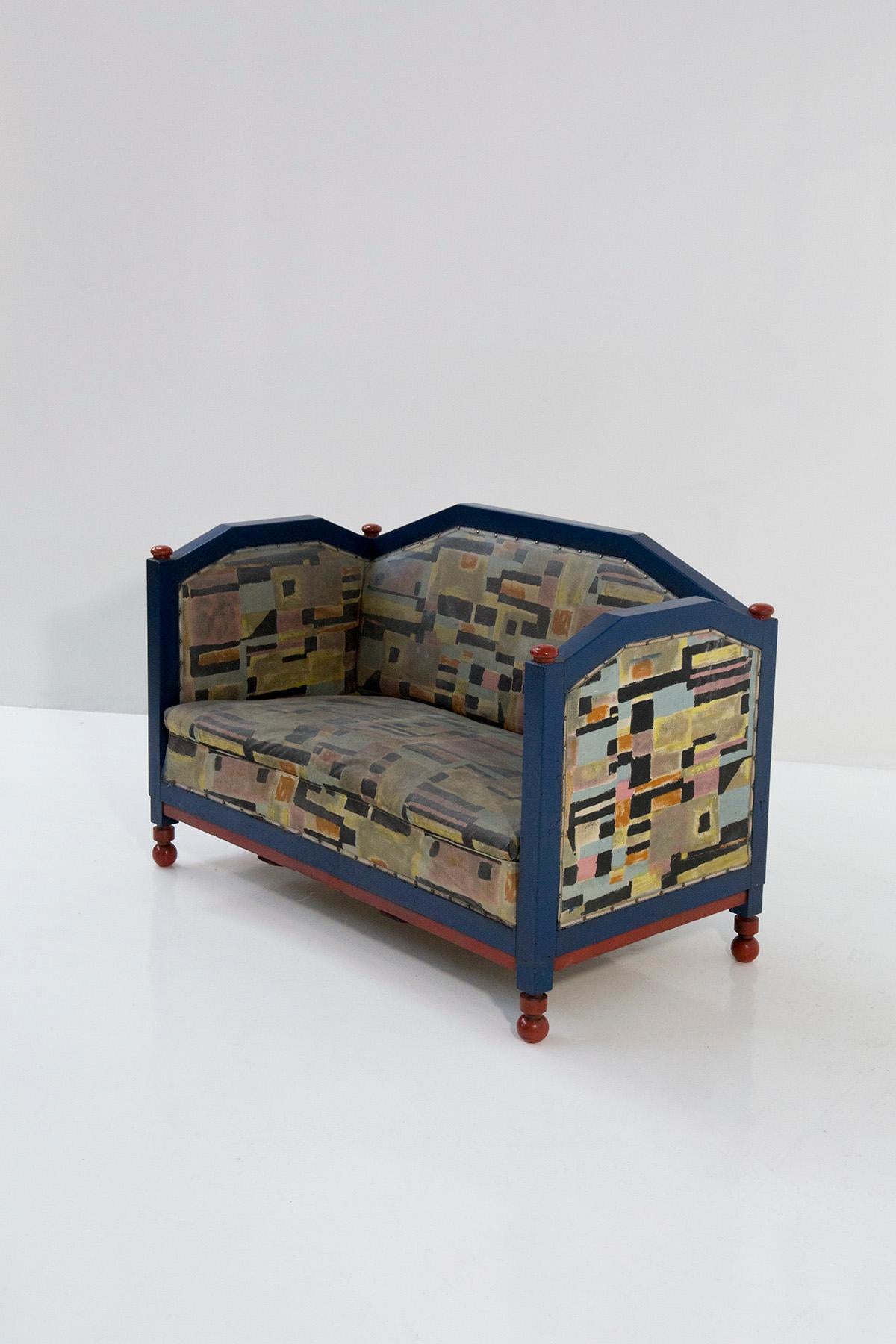 Immerse yourself in the enchanting world of the rare Italian Futurist two-seater sofa attributed to Fillìa Luigi Colombo—a remarkable testament to artistic ingenuity and historical significance. Allow its captivating details to unfold as we embark