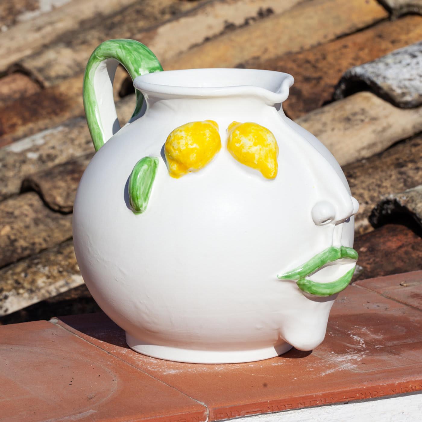Filomena, a Sicilian female steet vendor of lemons, inspired master ceramist Patrizia Italian to handcraft this stylish anthropomorphic pitcher in ivory-glazed ceramic with a matt finish. The nose and chin are superbly rendered in their dramatic
