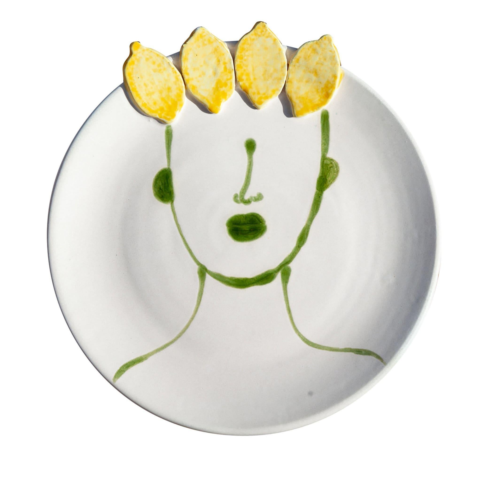 The natural flair of Sicily rendered through masterfully-interpreted symbols and striking artistic sensibility: this set of two ceramic dinner plates glazed in matte white boast the green decoration of a stylized human profile, their hair rendered