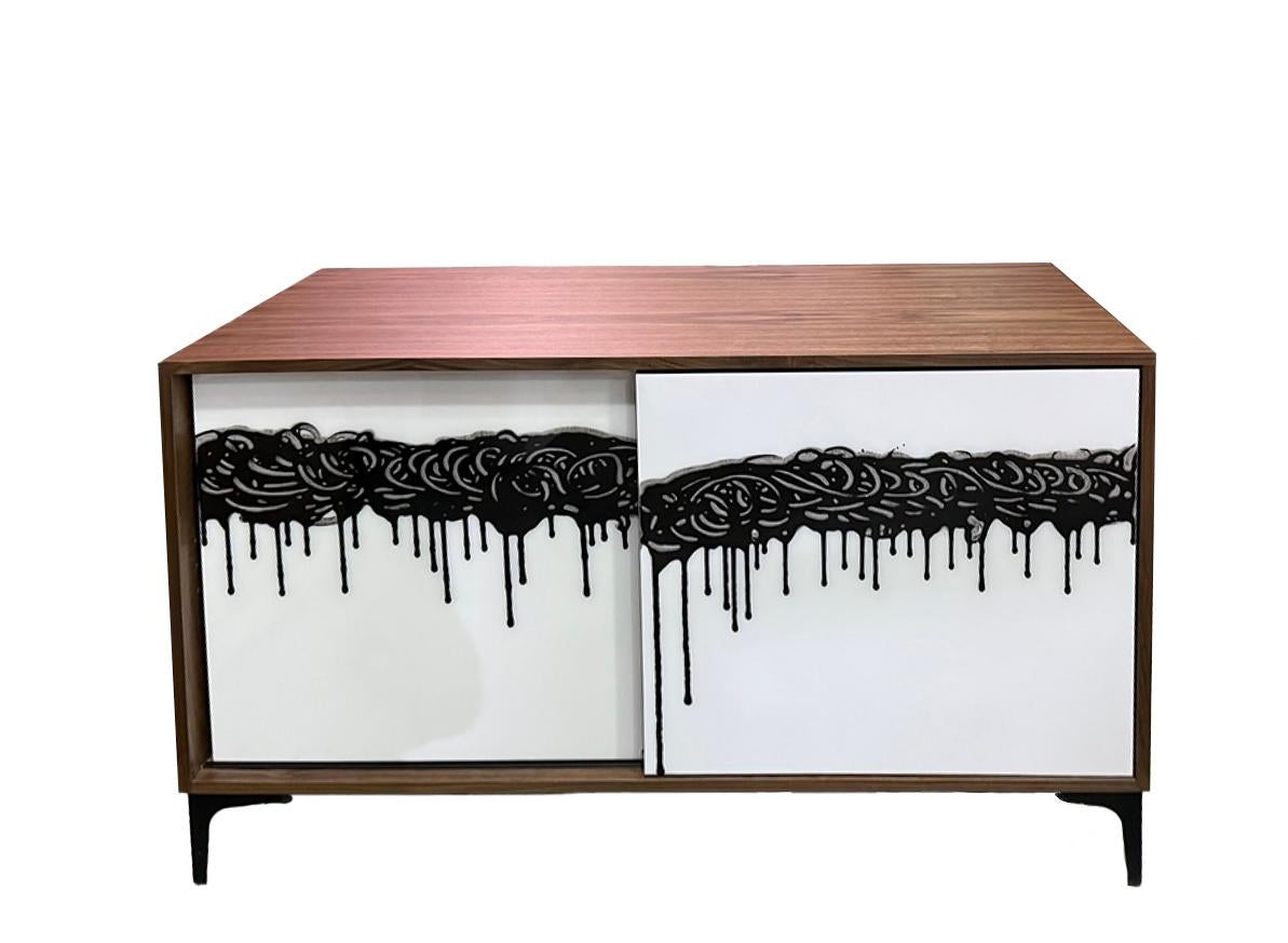The Finage Cabinet is a completed, ready-to-ship artwork-furniture hybrid created in our Toronto studio by Morgan Clayhall. Designed as a functional sculpture, the piece showcases Murray Duncan’s signature “Finage” artwork—an expressive band of