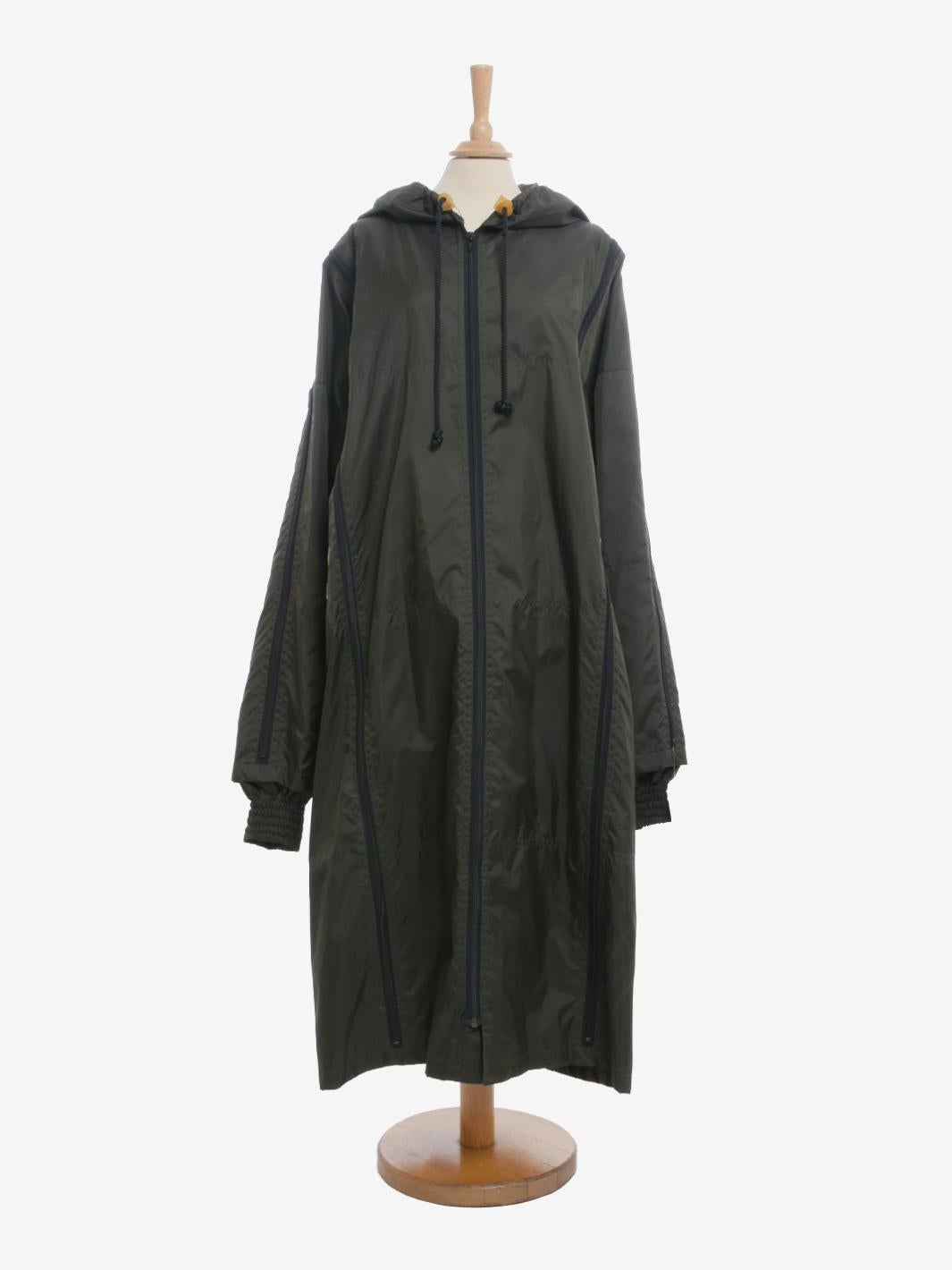 Final Home Trenchcoat is a raincoat by Japanese designer Kosuke Tsumura. Final Home was born in the 1990s and already indicates from its name the idea behind the design: to provide an ultra-practical garment that can at the same time transform into