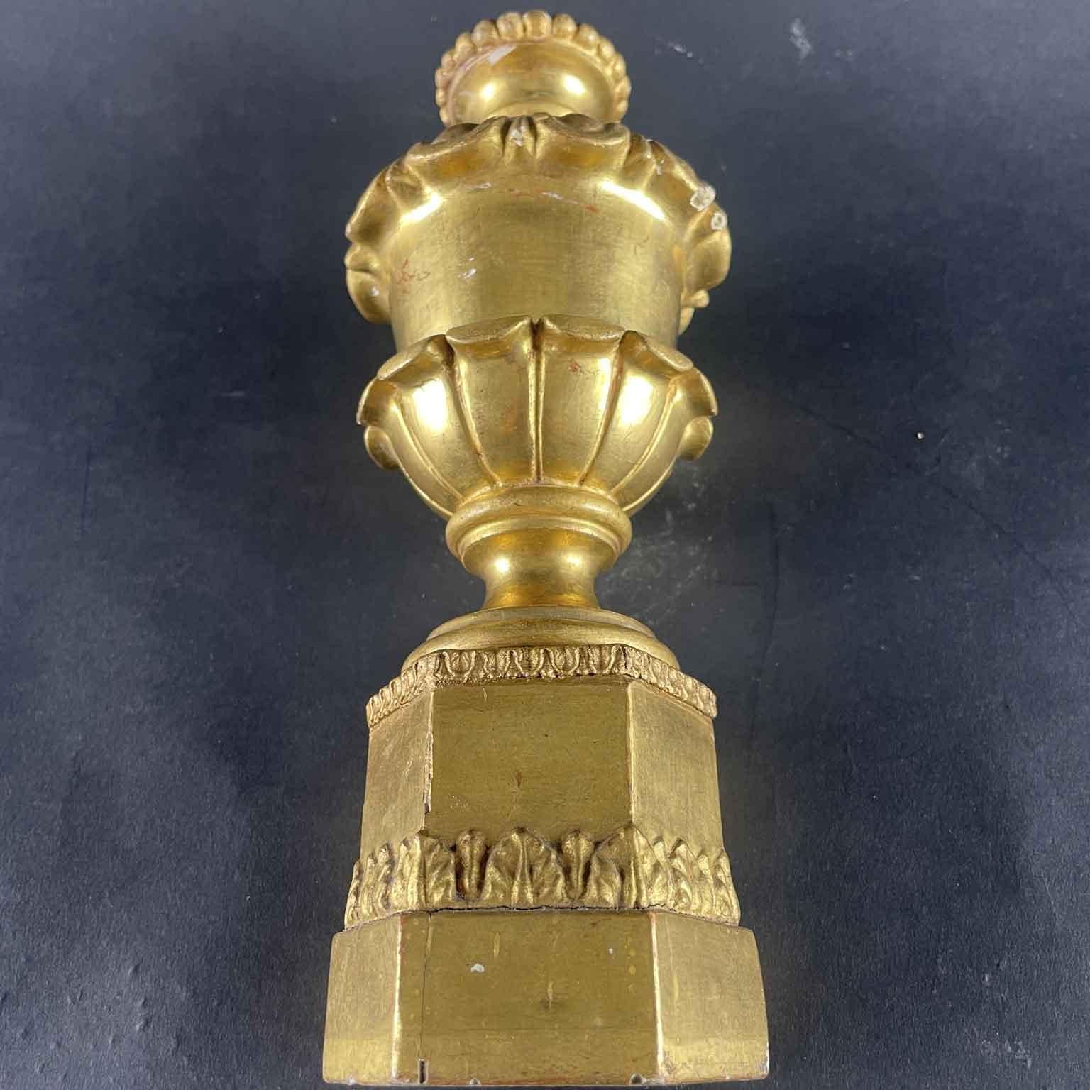 Italian Carved And Gilded Wood finials 1800s, set of four vases on hexagonal plinth with vegetal pastille carving frames, set of four turned and carved linden wood vases in the round with original fine gold leaf gilding on red bole preparation.