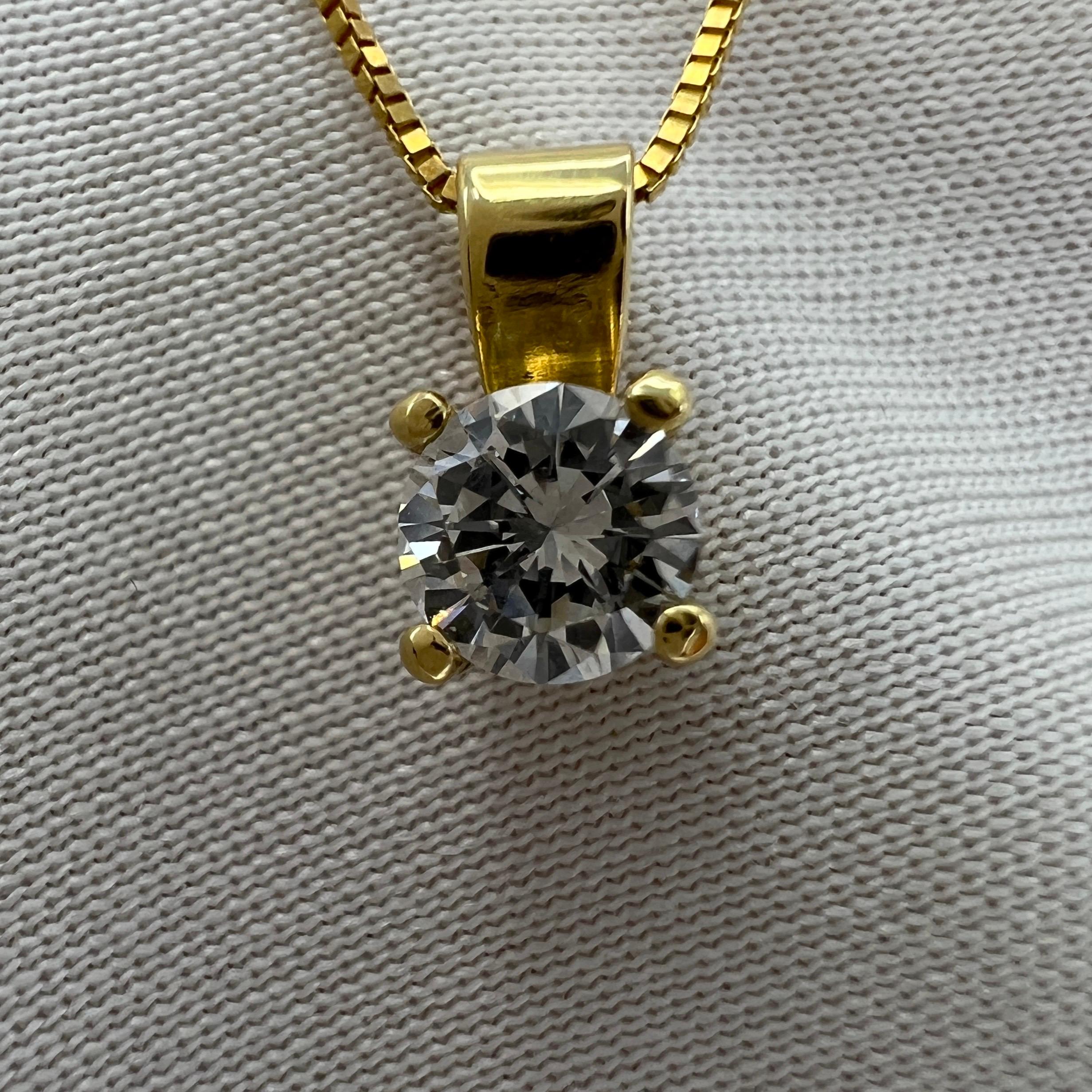 Fine Natural White Diamond Round Cut 18k Yellow Gold Solitaire Pendant Necklace.

0.27 Carat diamond with excellent colour and clarity. 
E/F colour and VS2 clarity. Very clean and very white. Also has an excellent round brilliant cut showing lots of