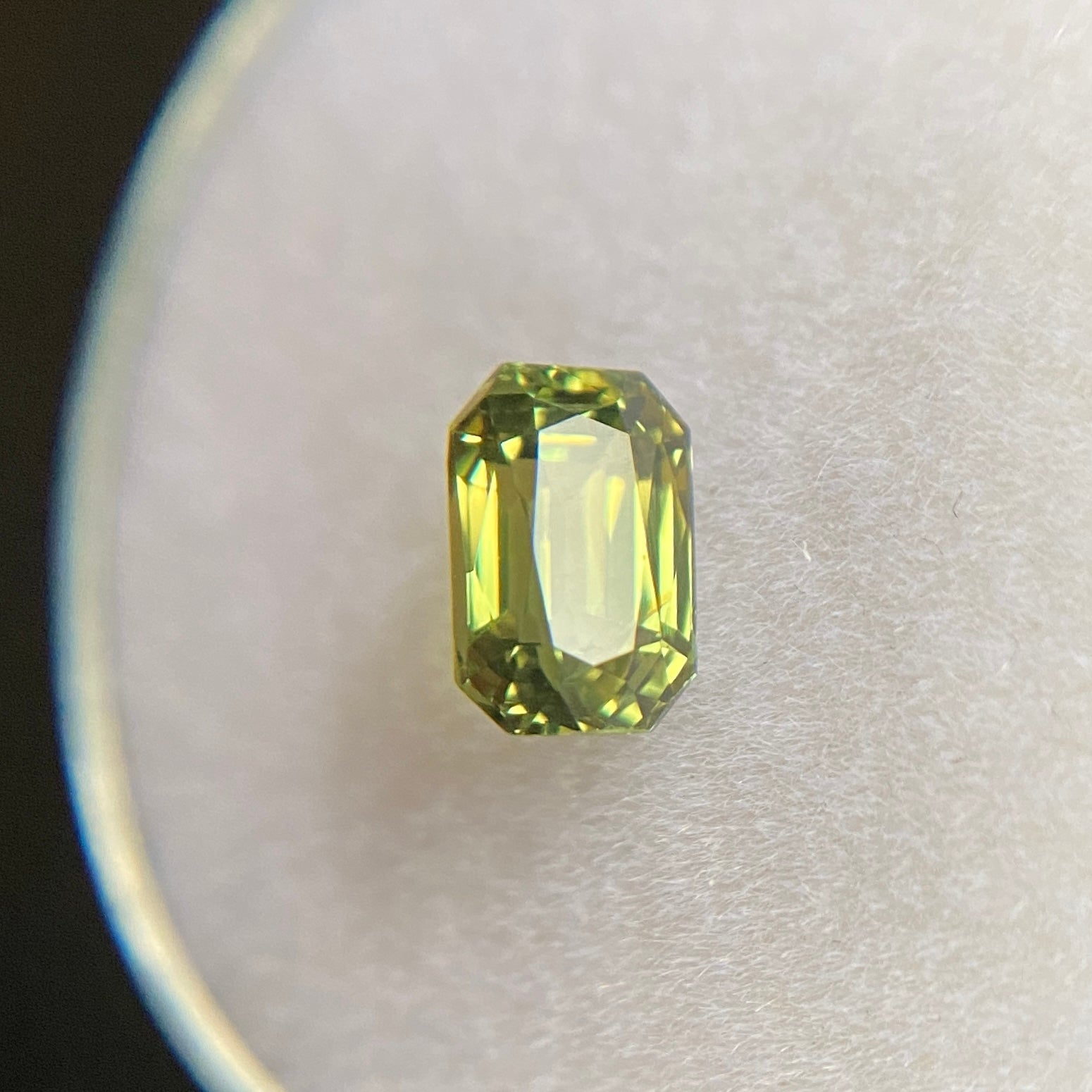Fine Natural Untreated Australian Green Sapphire Gemstone.

1.12 Carat with a beautiful yellow green colour and an excellent emerald octagon cut. Also has very good clarity, a very clean stone.

Totally untreated and unheated, very rare for natural