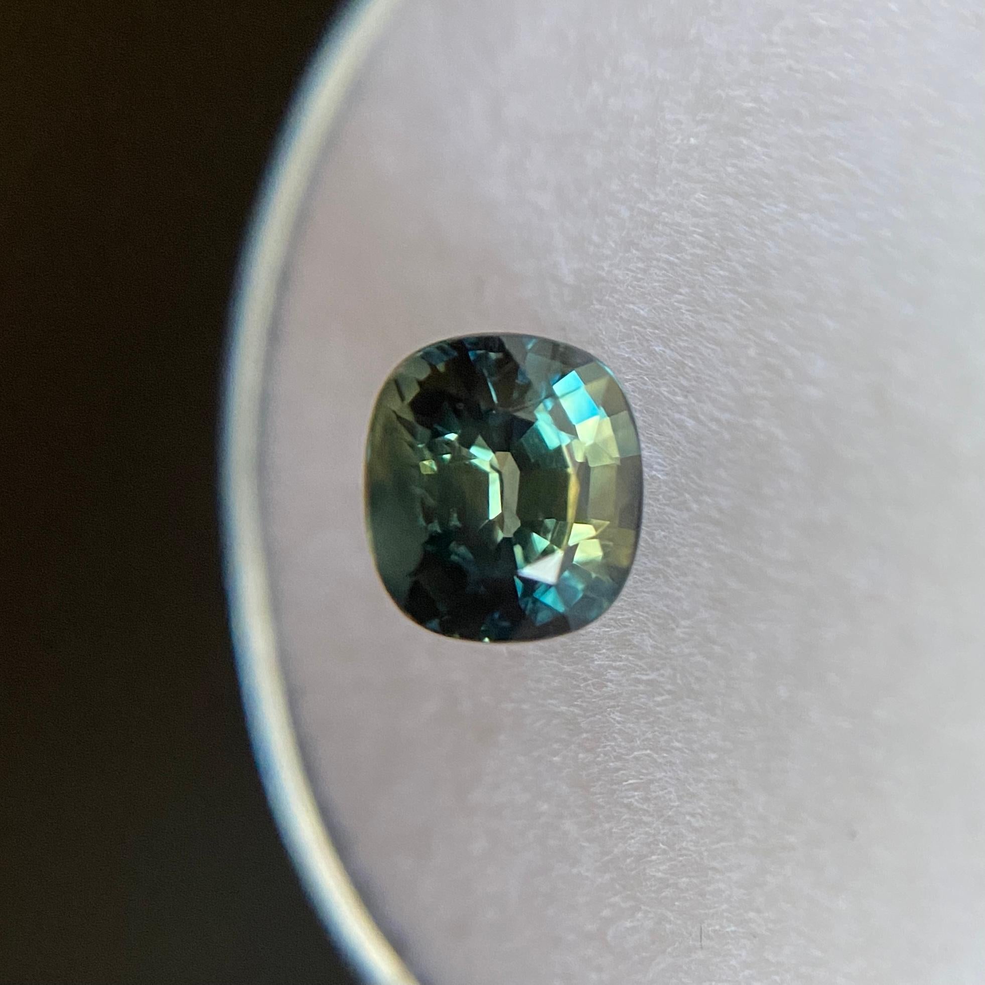 Fine Natural Green Blue Bi Colour Australian Sapphire Gem.

1.42 Carat with a beautiful and unique green blue bi-colour effect. Rare and stunning to see. Also has very good clarity, a very clean stone.

The sapphire also has an excellent cushion cut