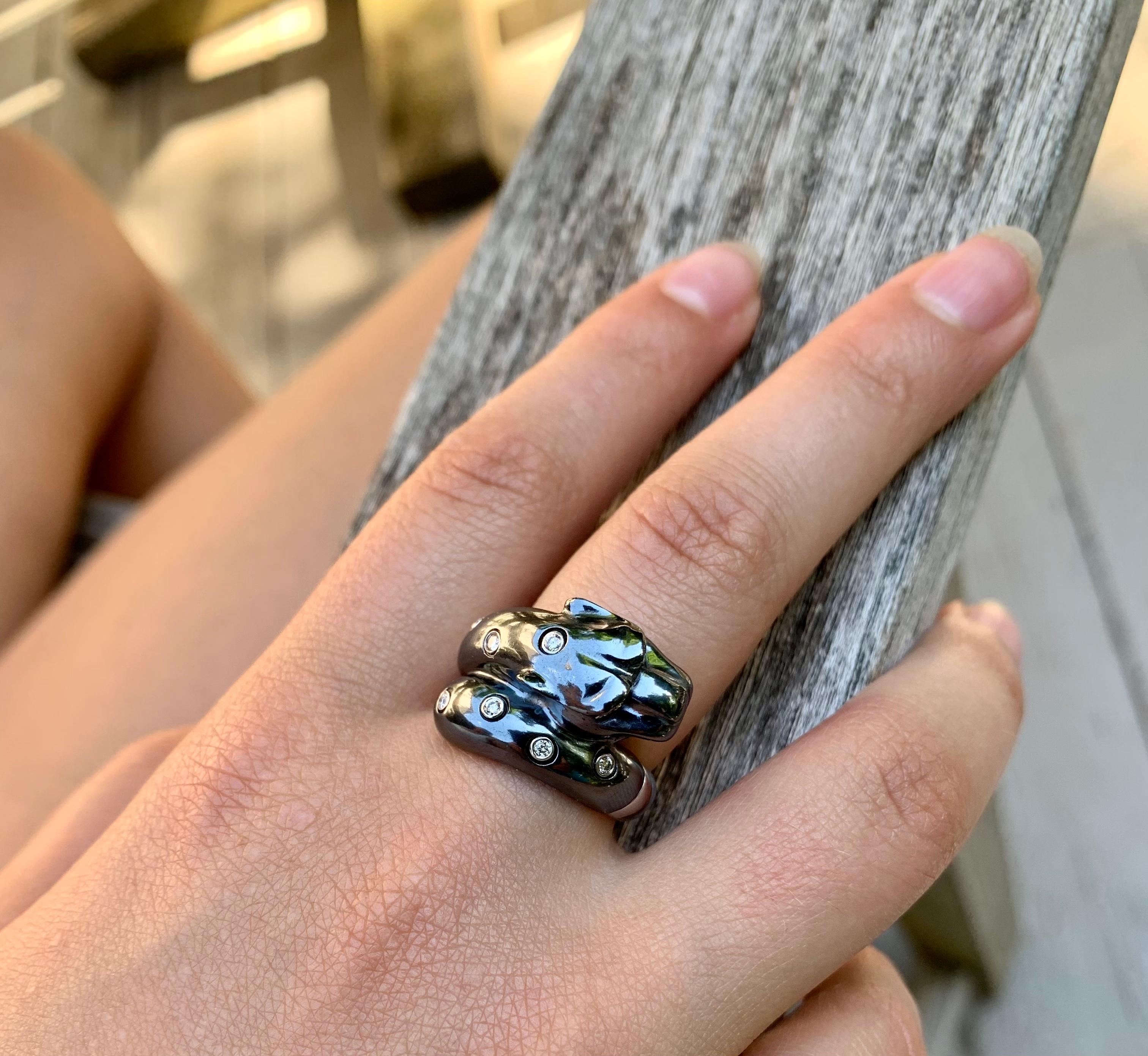 Elegant estate panther ring, diamond set 18K white and blackened gold.
Marks: 18K, 750, jeweler's mark, numbered
Size 7.5 US
23mm by 14mm
Excellent condition
The panther epitomizes power, beauty and grace. This fabulous feline has created a