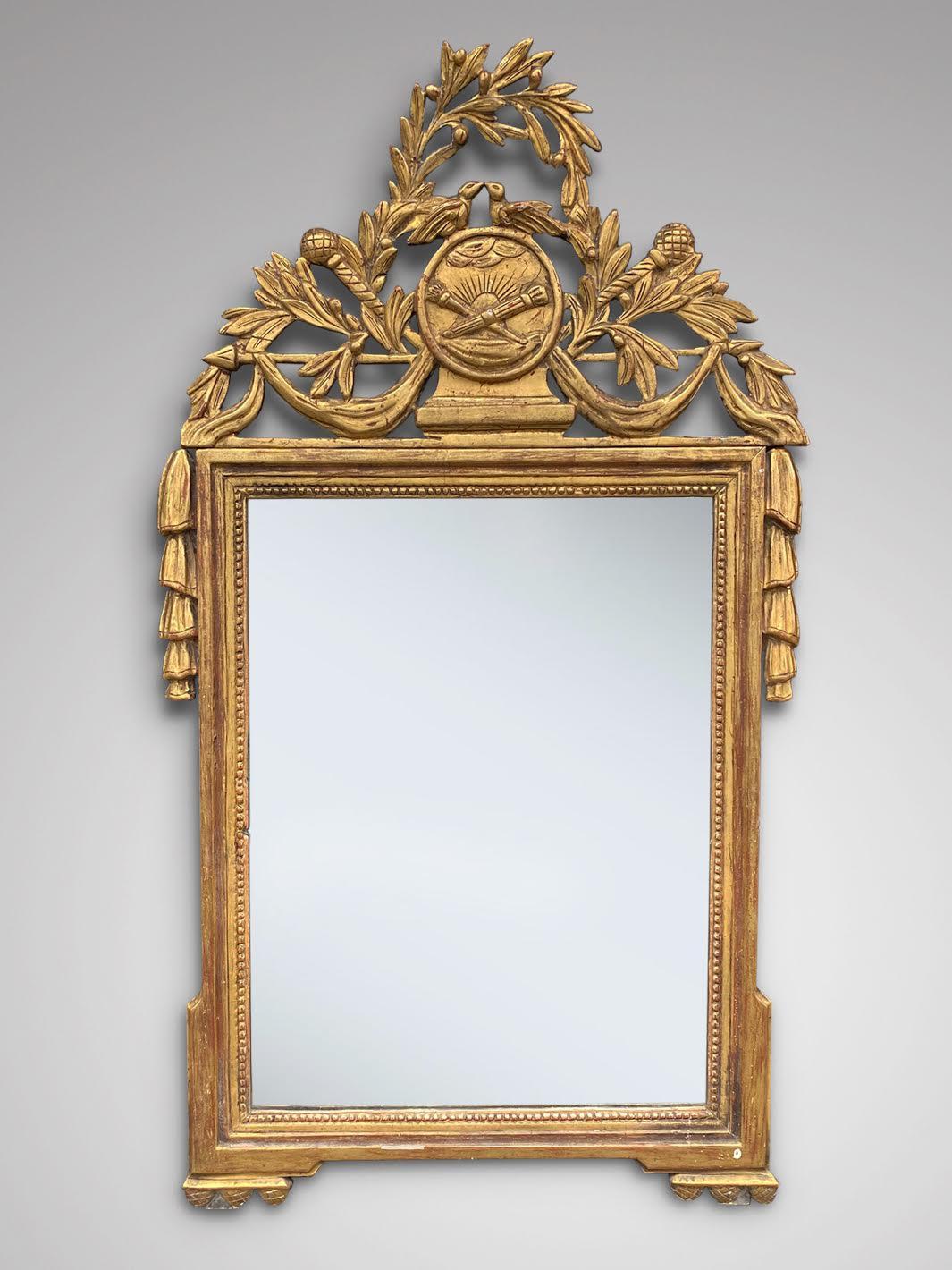 A very fine late 18th century French gilt wood framed pier wall Mirror of rectangular form, the top paired with birds & foliate sprays, the upper side corners with draping, original gilding and mercury plate mirror. Original back. France circa