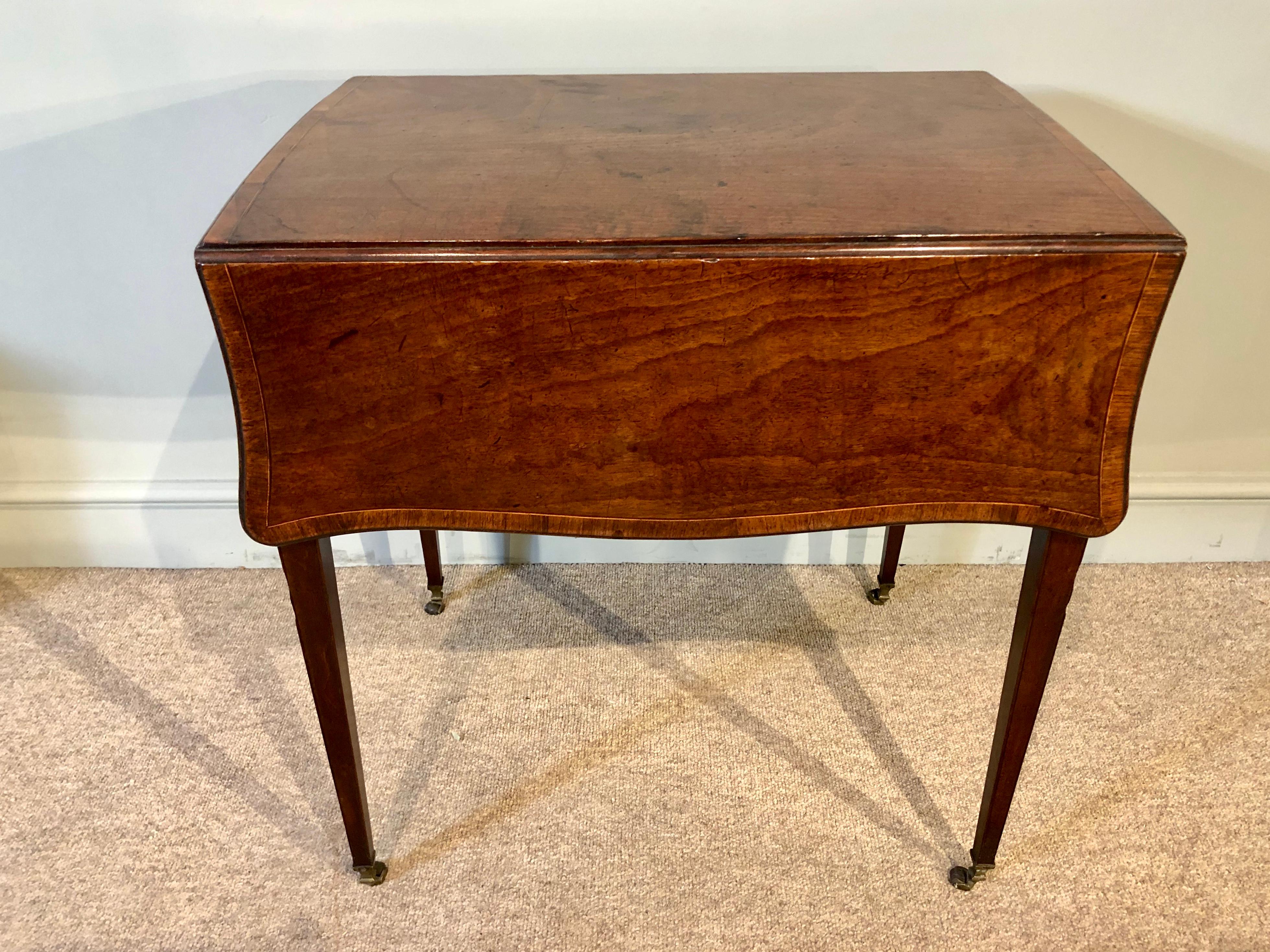 A very fine late 18th century beautifully figured Hepplewhite fiddleback mahogany butterfly Pembroke table of exceptional color and patina. Original handles throughout, a deep drawer to one side and dummy drawer to the other. The elegant square