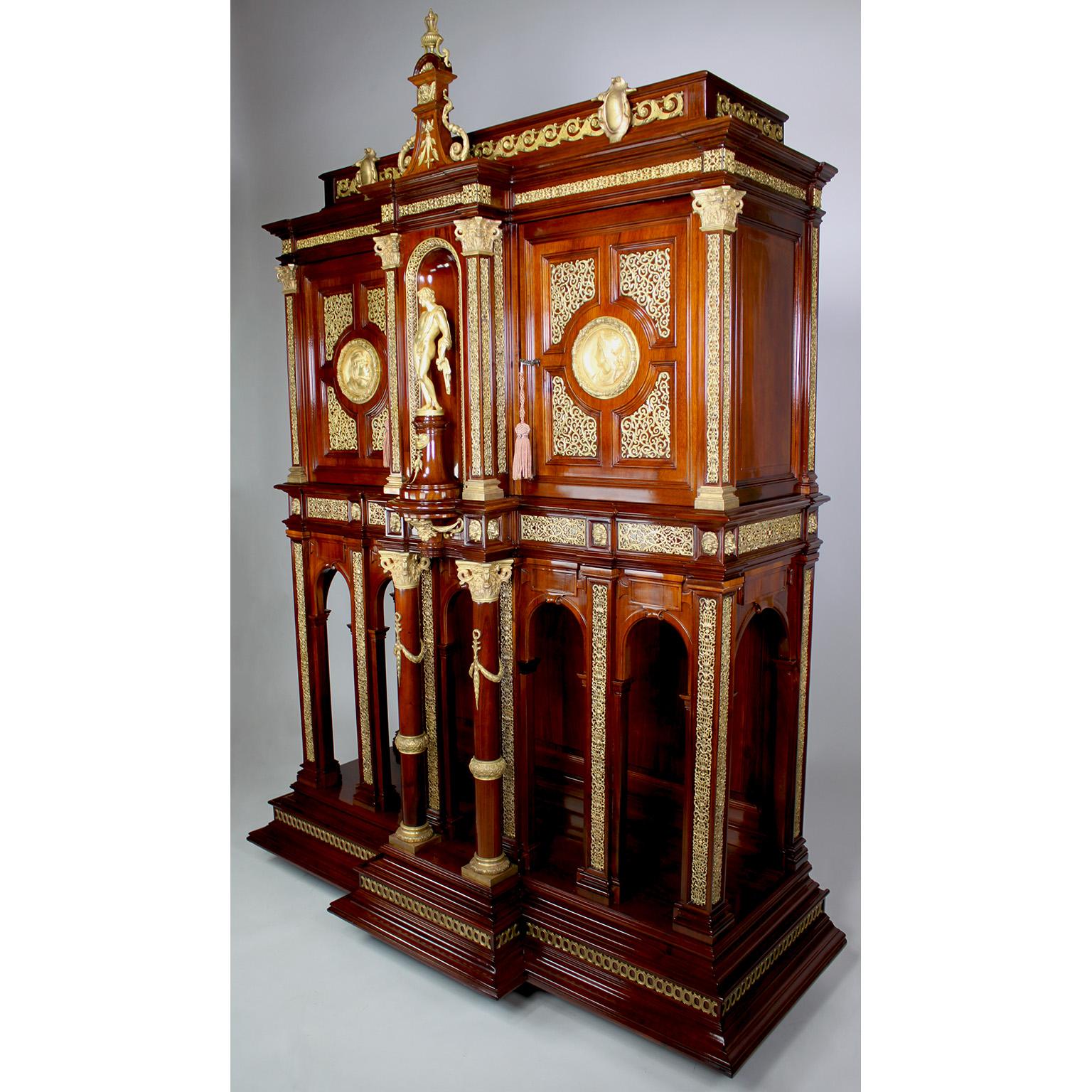 A Fine French 19th Century Neo-Renaissance Style Gilt-Bronze Mounted Walnut and Mahogany Two-Door Bargueno or Cabinet on Stand, attributed to Paul Sormani (1817-1877), designed Édouard Lièvre (1828-1886) and retailed by Poujol - Paris. The spreading