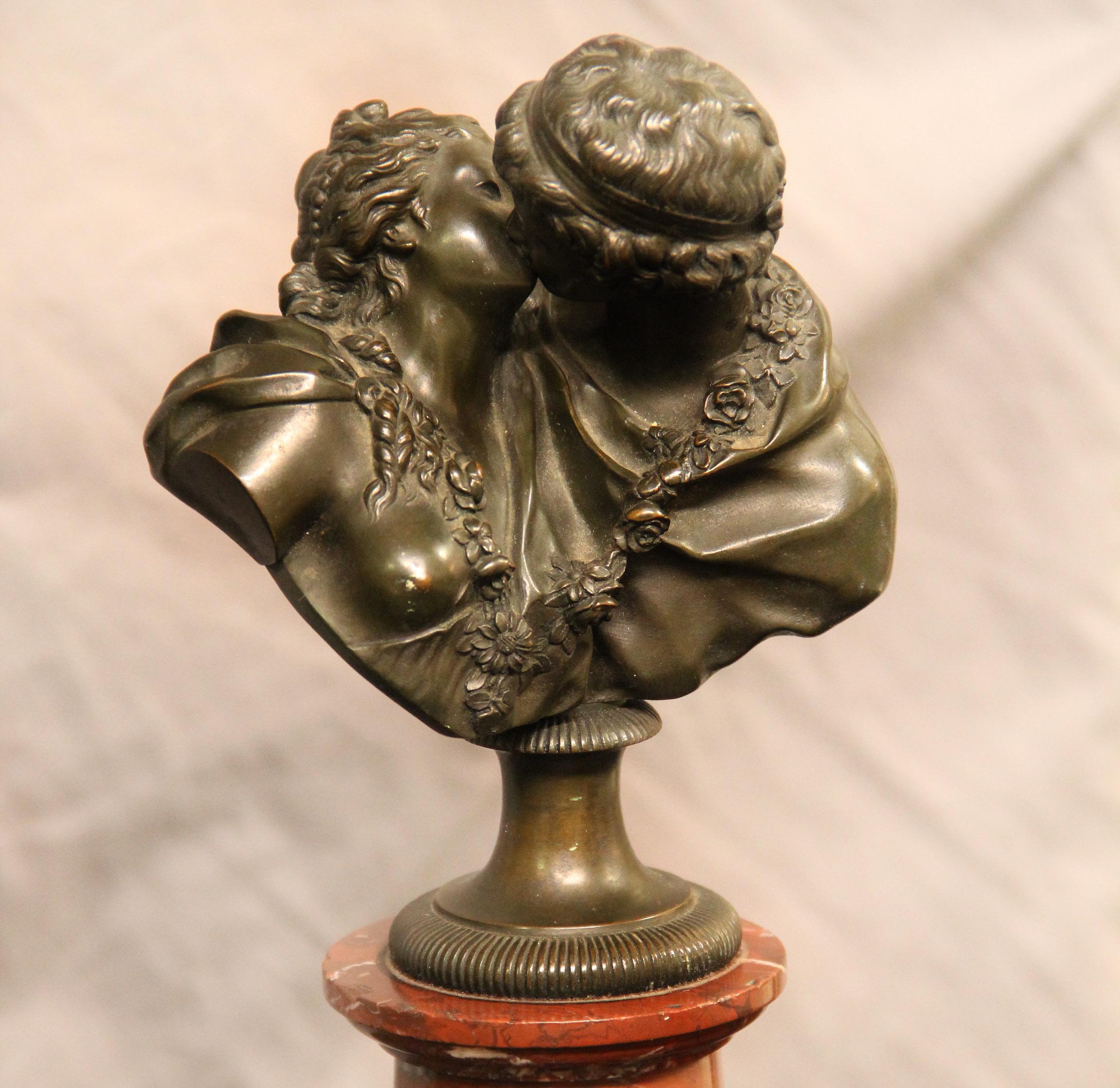 A fine 19th century bronze bust of two lovers entitled “Le Baiser” by Jean- Antoine Houdon

A beautiful bronze sculpture of a kissing couple standing on a red marble base.

Signed Houdon and stamped Susse Feres to the back.

Jean-Antoine