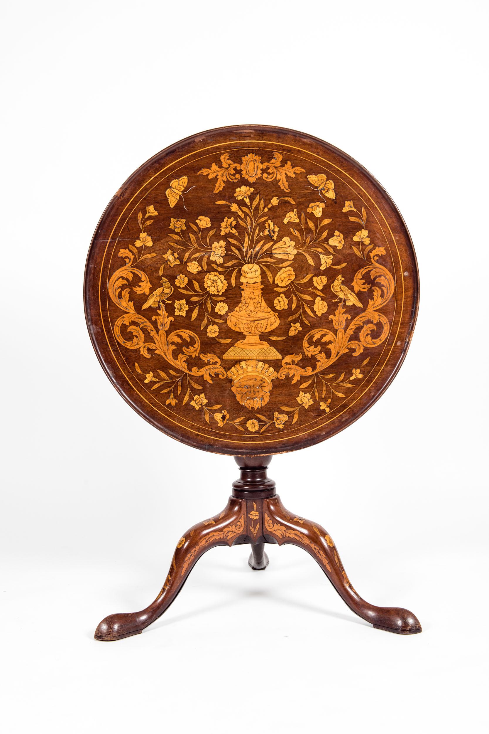 A very fine 19th century Dutch Marquetry inlaid round tilt-top table. The marquetry tilt-top is in good antique condition . Minor wear consistent with age / use . Minor structural instability , The holding socket under the table needs to be change .