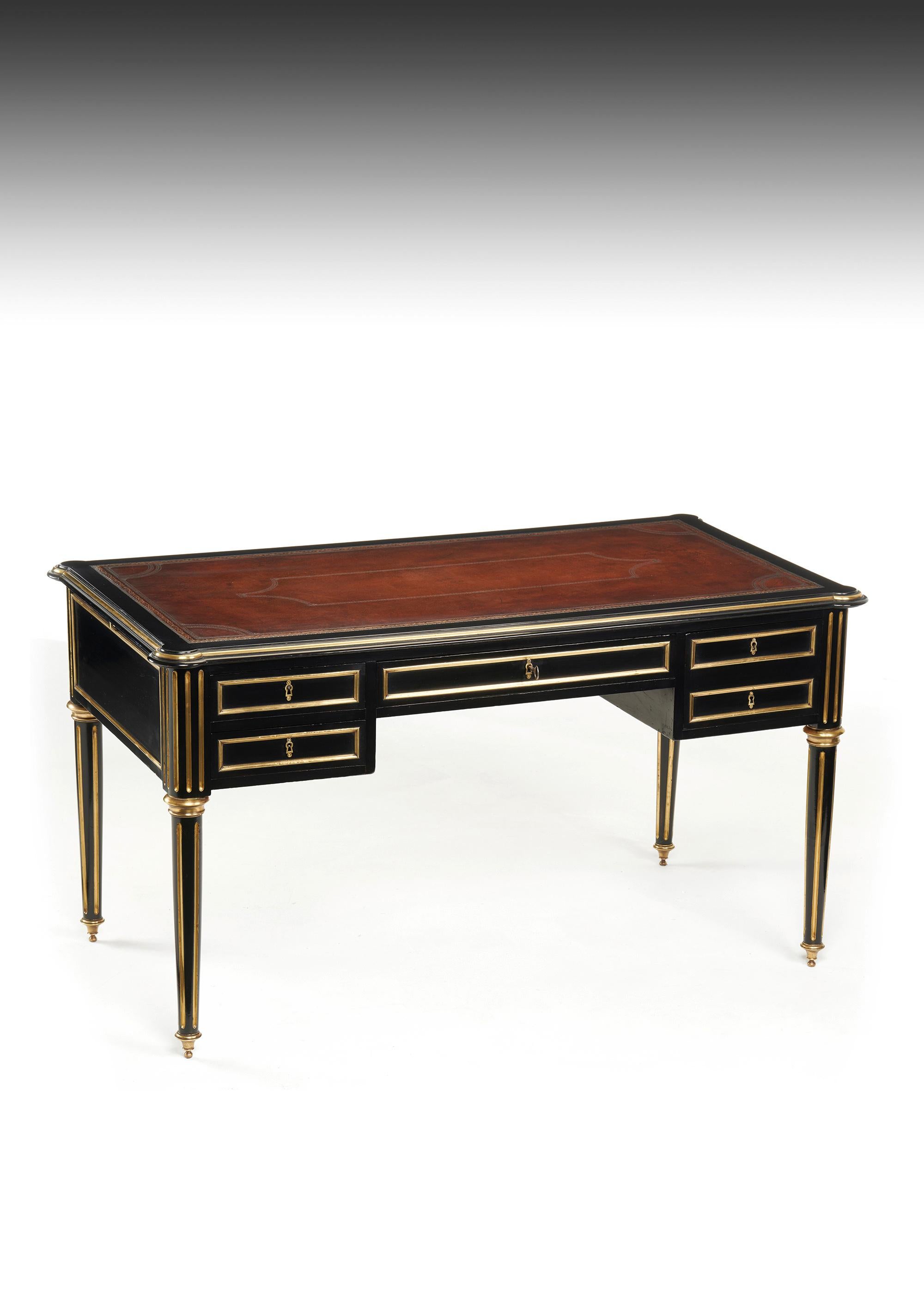A stunning ebonised and brass mounted French writing table / desk in the style of Louis XVI with lobed corners most probably made by a Parisian Cabinet Maker.

French, circa 1880.

This fine quality antique desk also can be known as a bureau