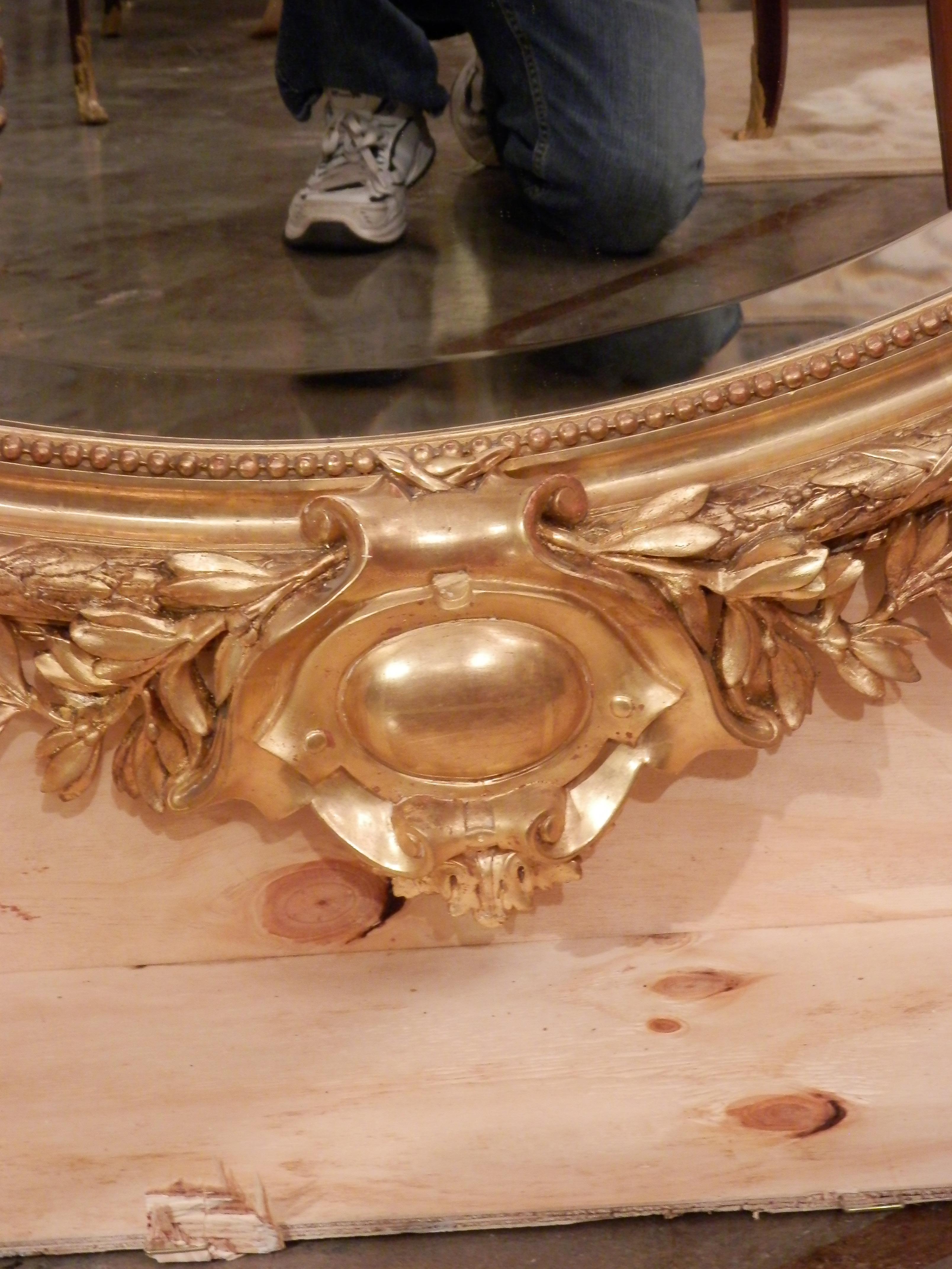 Very fine large French Louis XV carved water gilt large oval mirror.