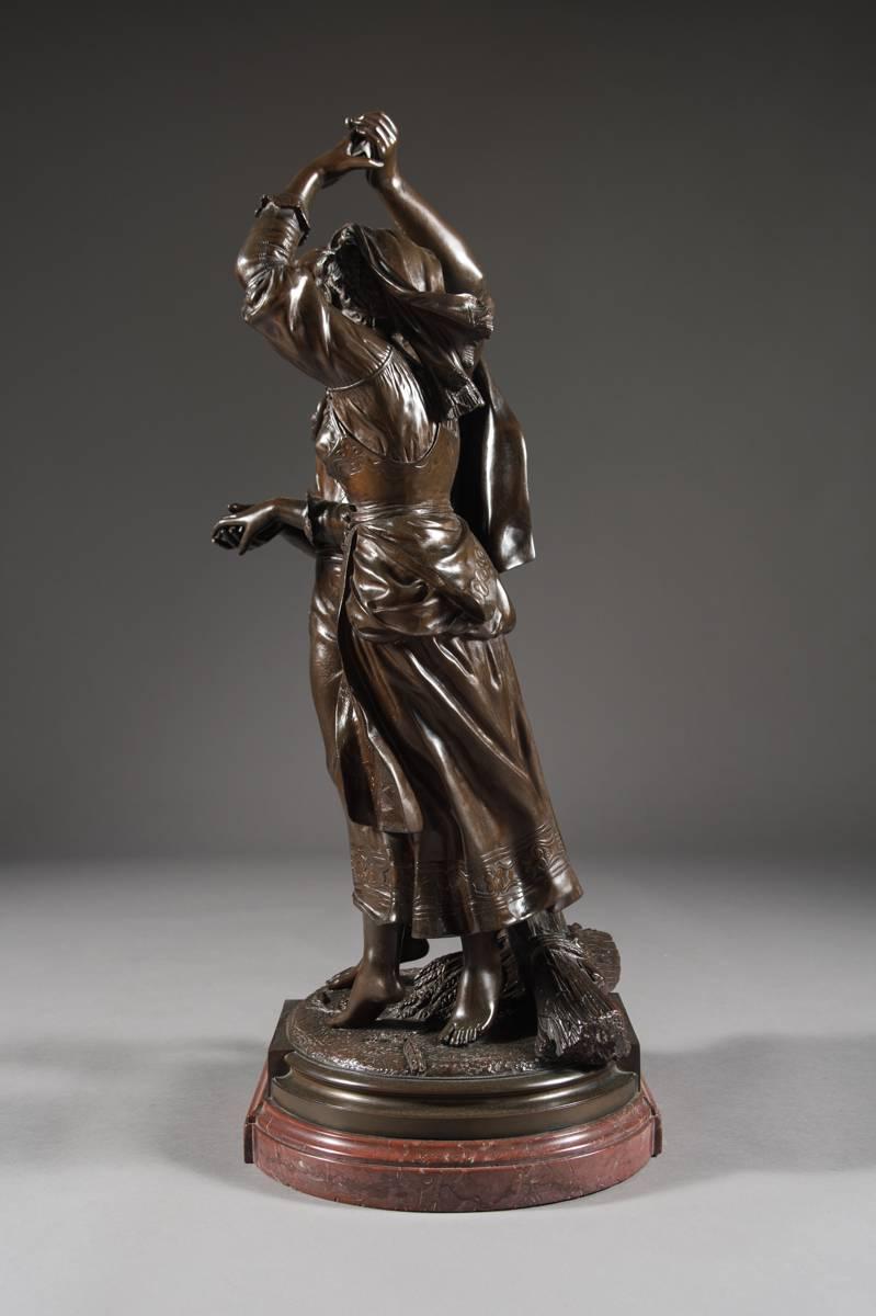 A charming 19th century French patinated bronze group by Jean Didier Début on a rouge marble base. Modeled as a barefoot couple holding hands dancing around a harvest. 

Titled: La Moisson or The Harvest. 

Signed: Debut, and Boucher Fres