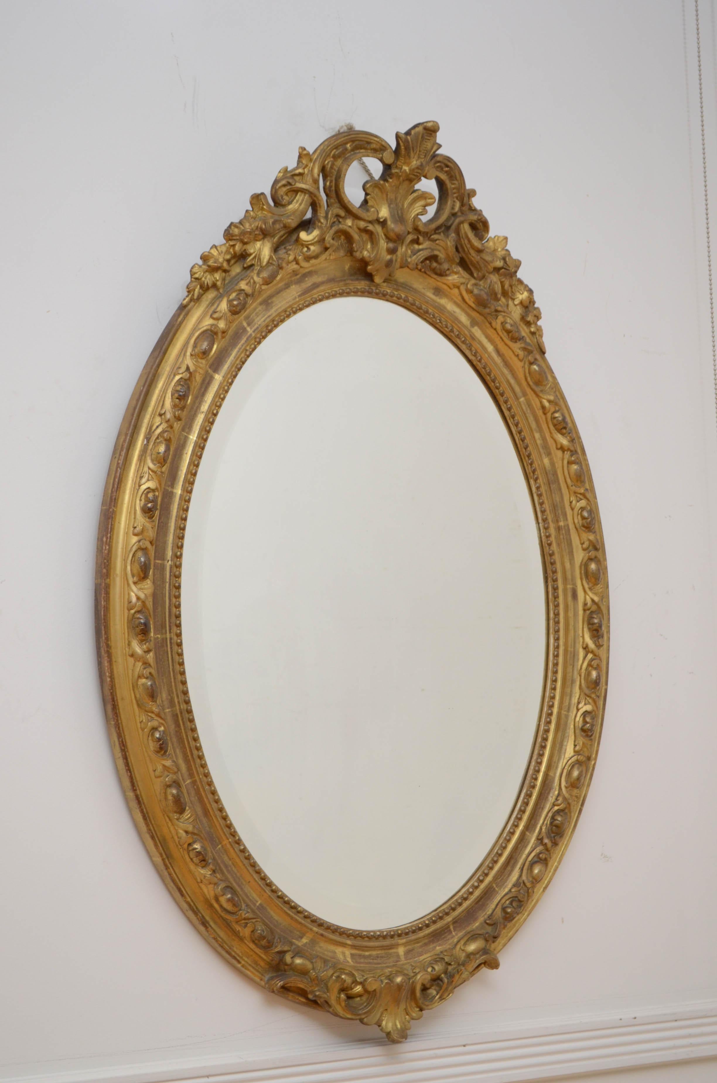 Fine 19th century hand carved mirror in Rococo style, having original bevelled edge glass with some speckle in finely carved frame. The frame is carved with ‘les pearls’ which symbolises strand of pearls and leaf motifs throughout. This mirror has