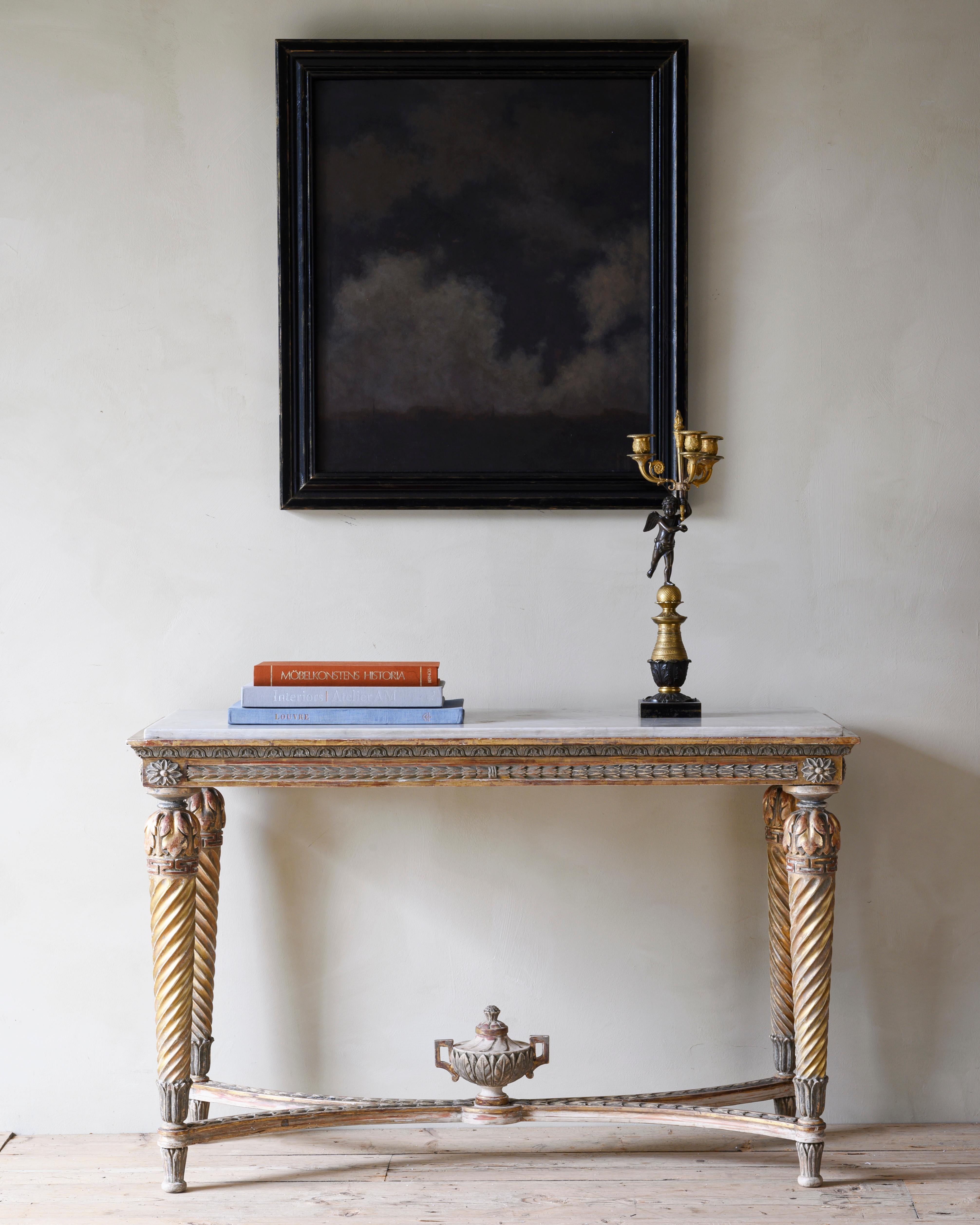 Fine and unusually large 19th century Gustavian gilt wood console table with Carrara marble top. Carved on all four sides which means it can also be used as a centre table. Ca 1820 Stockholm Sweden.