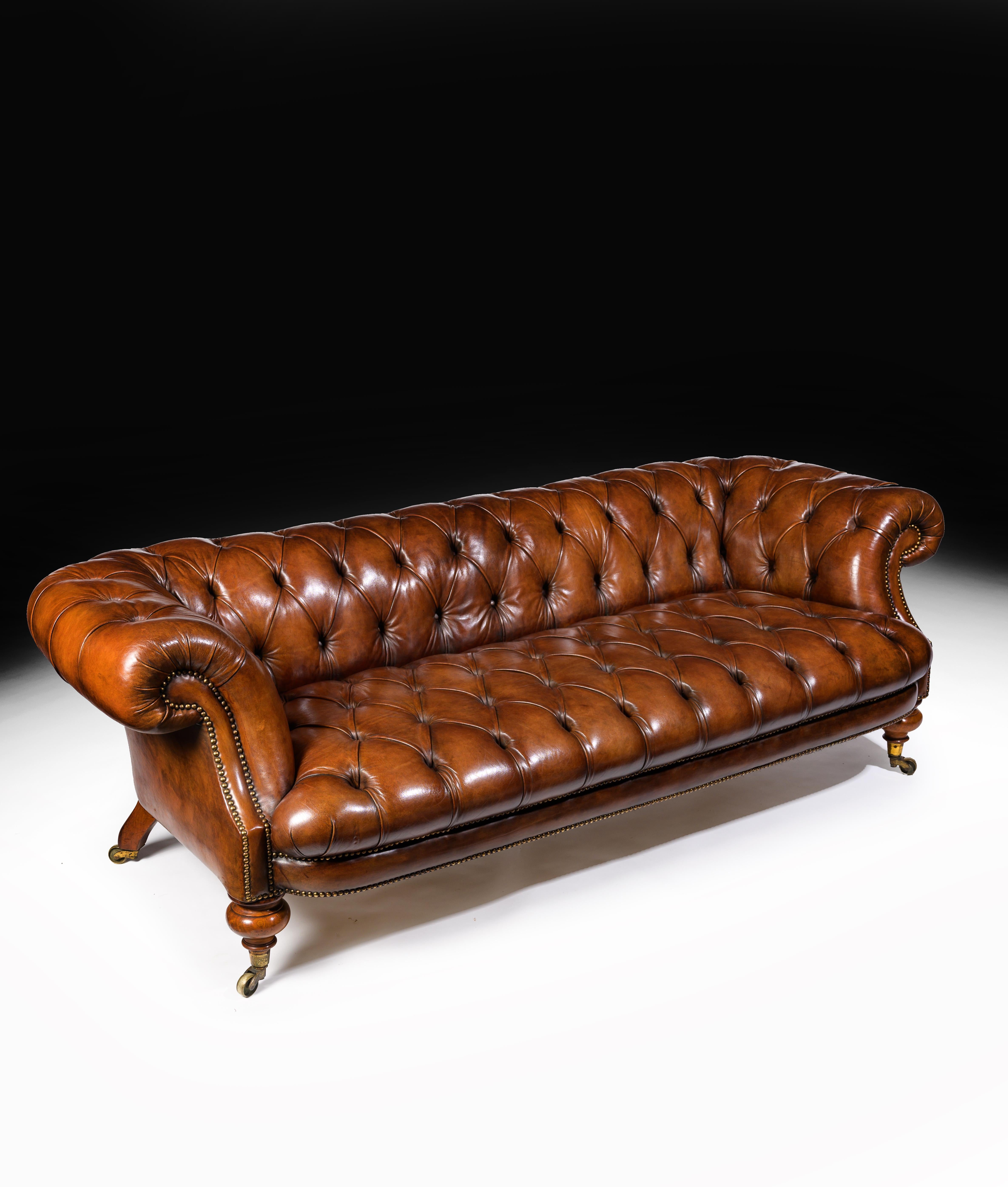 A Stamped “Johnstone & Jeans 67 New Bond St London” walnut 19th Century Victorian period tufted leather chesterfield.

English, circa 1860. 

A rare and extremely well drawn, having good deep proportions, 19th century figured walnut Chesterfield