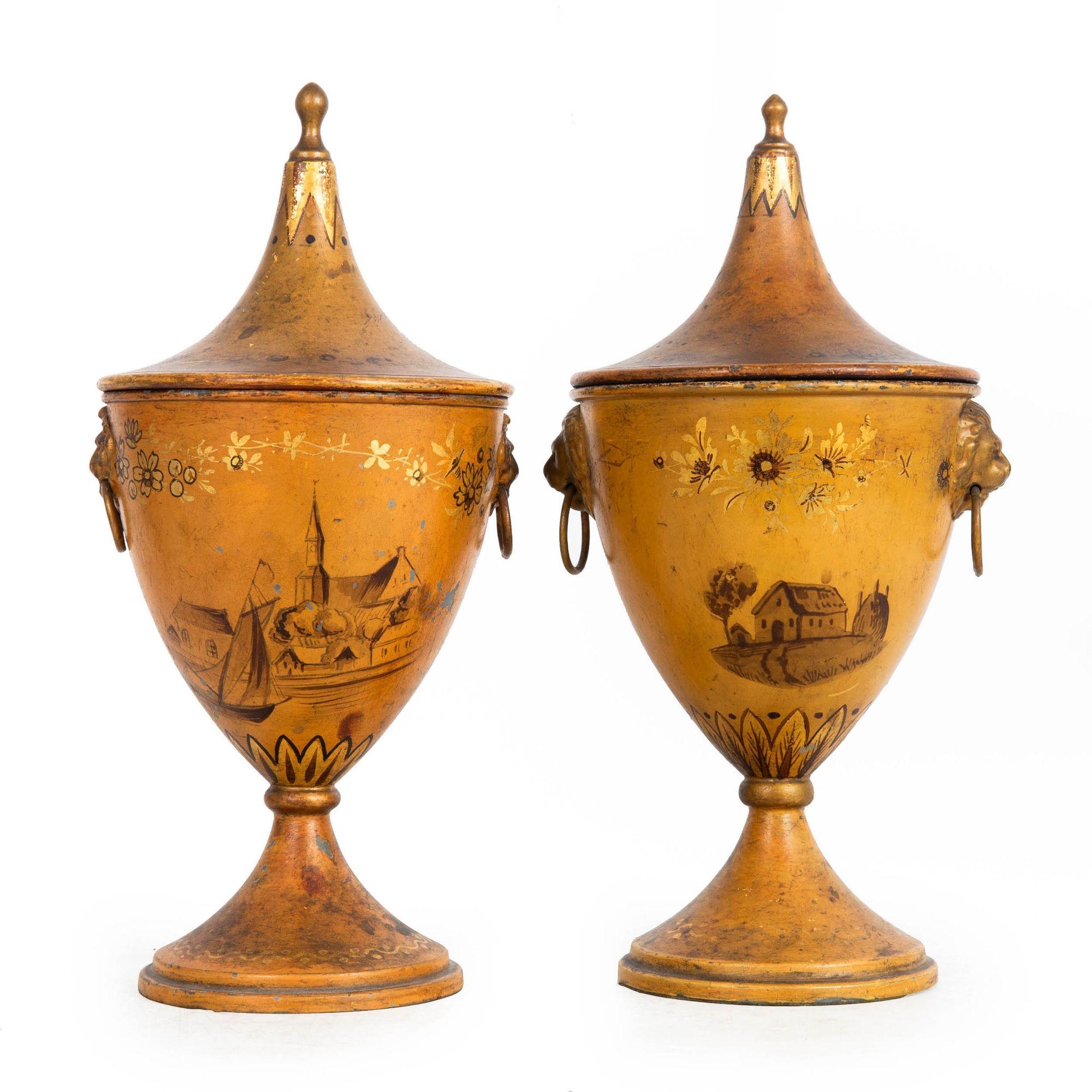 A FINE NEAR-PAIR OF REGENCY TOLE-PAINTED CHESTNUT URNS WITH LION MASKS
Probably Dutch, ca. first half of the 19th century
Item # 402YTP08P

An incredibly beautiful pair of chestnut urns from the Regency era, these are a 