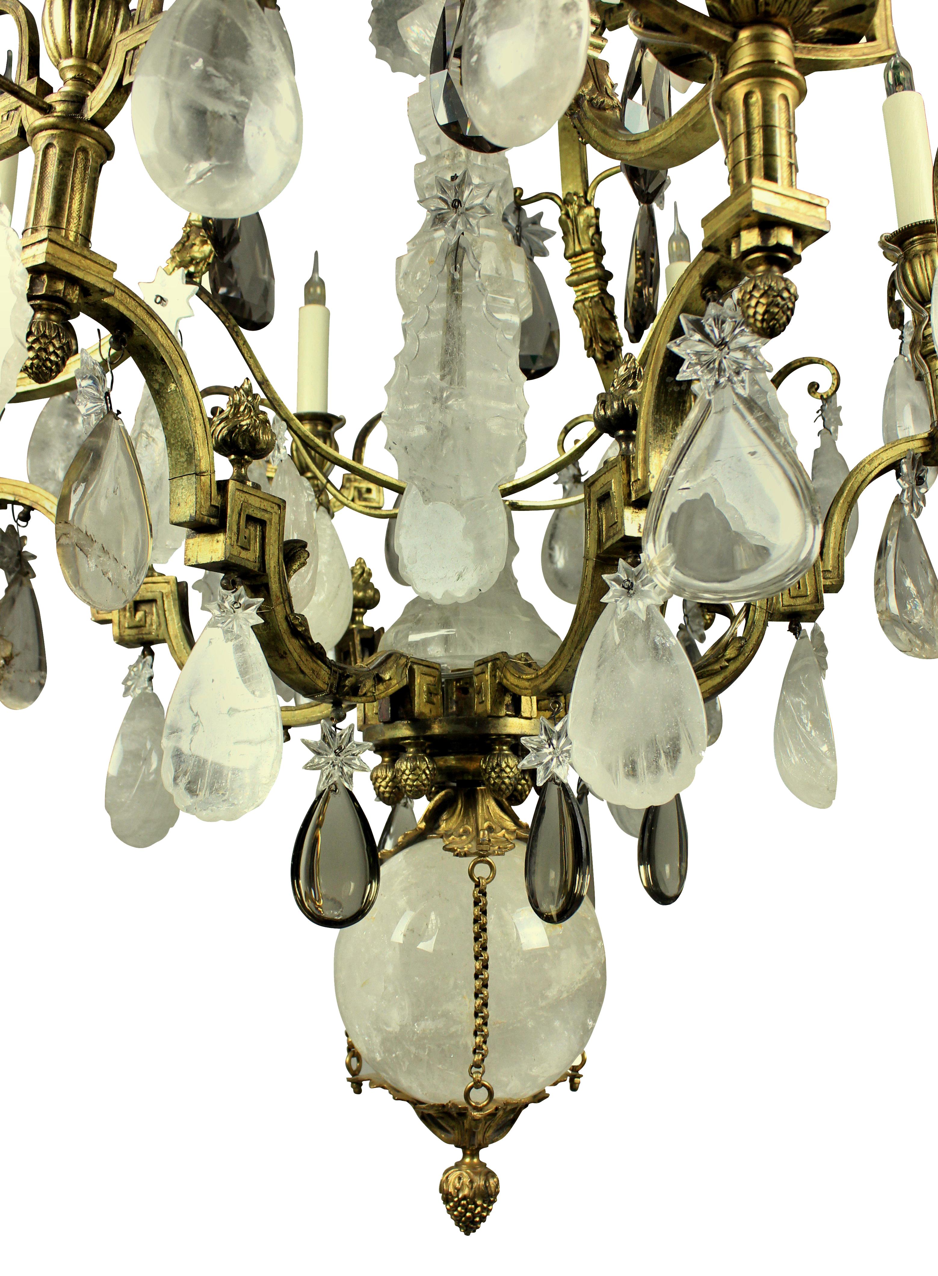 A fine Russian neoclassical gilt bronze and rock crystal chandelier with smoked quartz drops. Made in France for the Russian market.

The ball has a diameter of 18 cm and the largest plaque is 18 cm.