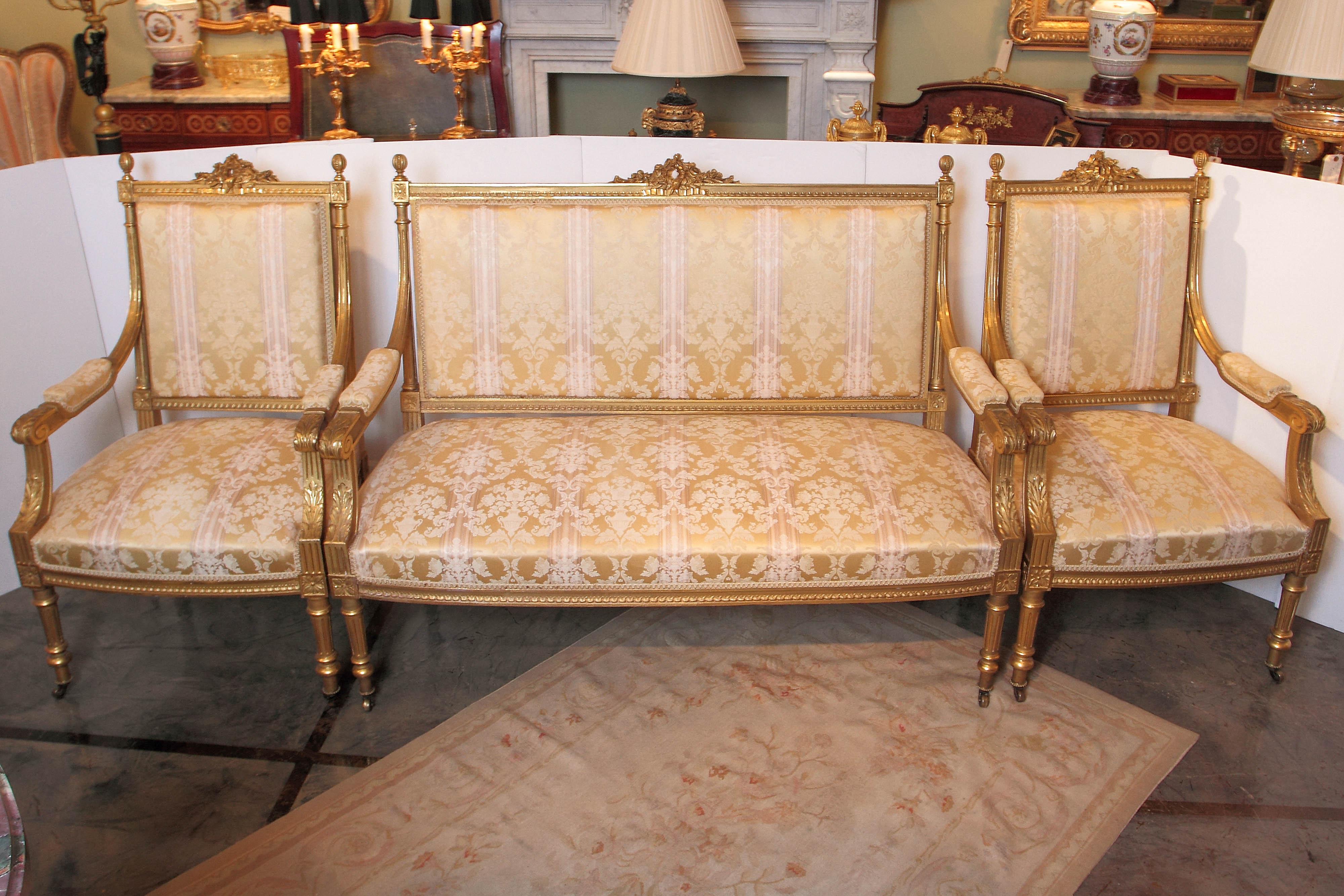 Fine quality 19th century French Louis XVI water gilt settee and chairs. Finest quality carving and gilding. From a prominent estate in the Hamptons New York.