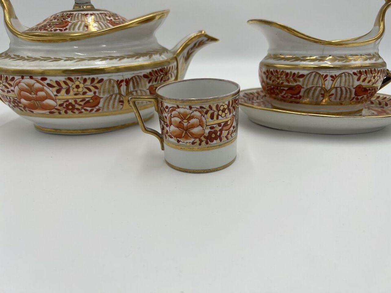 Spode (English, founded 1770), circa 1820. An extremely fine quality and rare personal tea service in rust and gold. The surfaces are decorated in an imari style pallet - laurel leaf banding, trees of plenty and birds. Included is a large teapot,