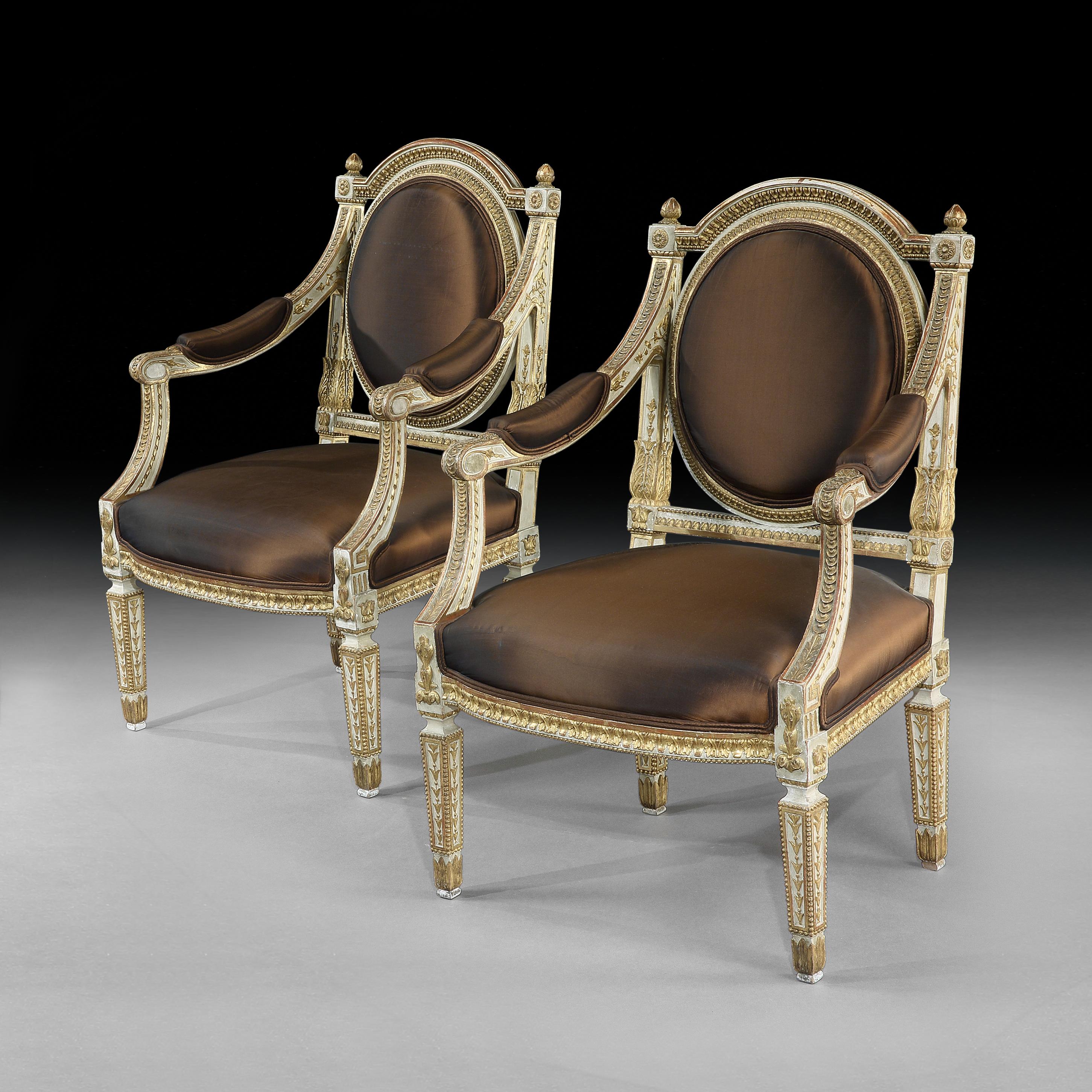 Neoclassical Revival Fine and Decorative Pair of Italian Painted and Parcel Gilt Armchairs of