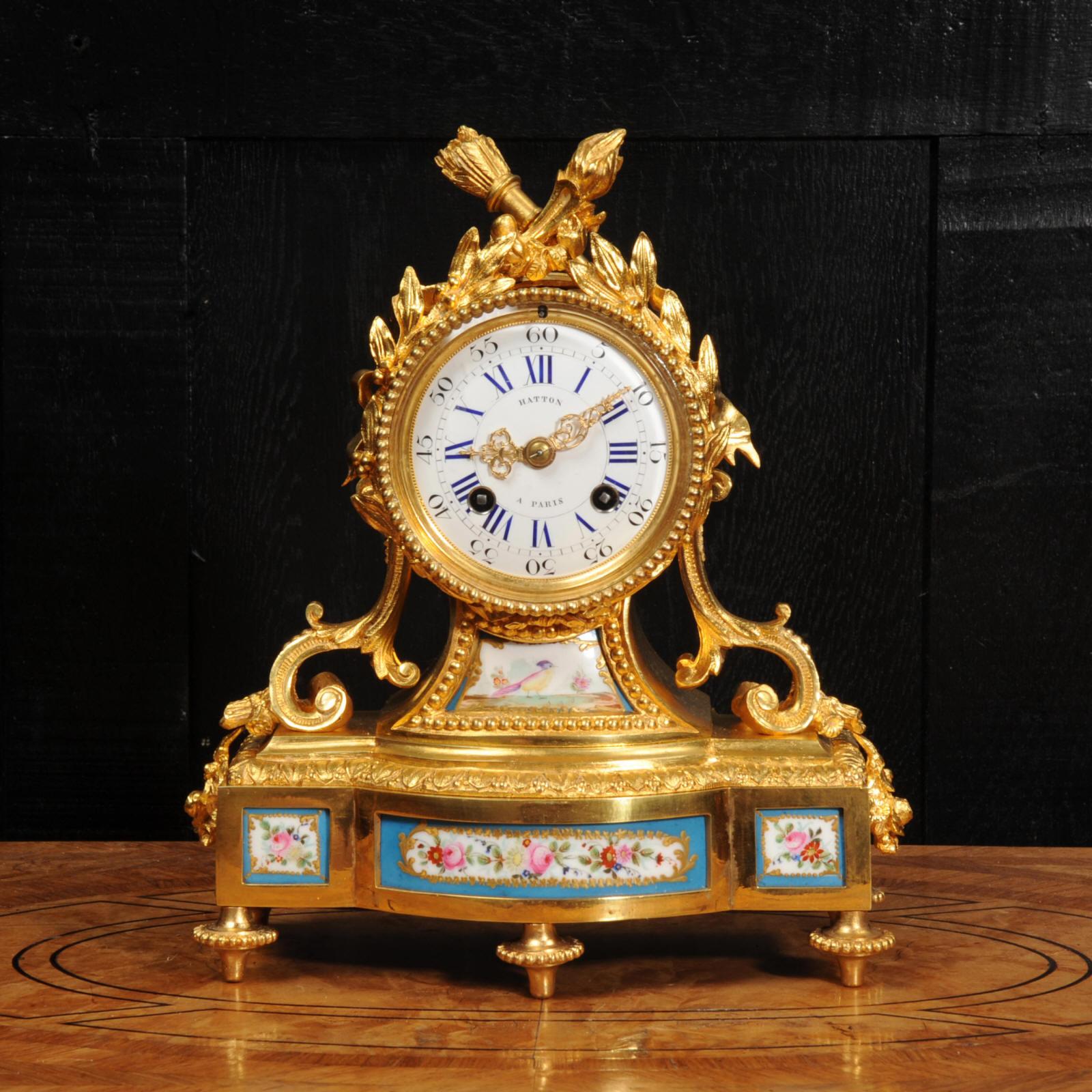 A fine, early antique French clock by Hatton of Paris, circa 1850. It is beautifully made in ormolu (fire gilded bronze doré) mounted with exquisite Sèvres style porcelain. The porcelain has a Bleu Celeste ground with delicately painted flowers and