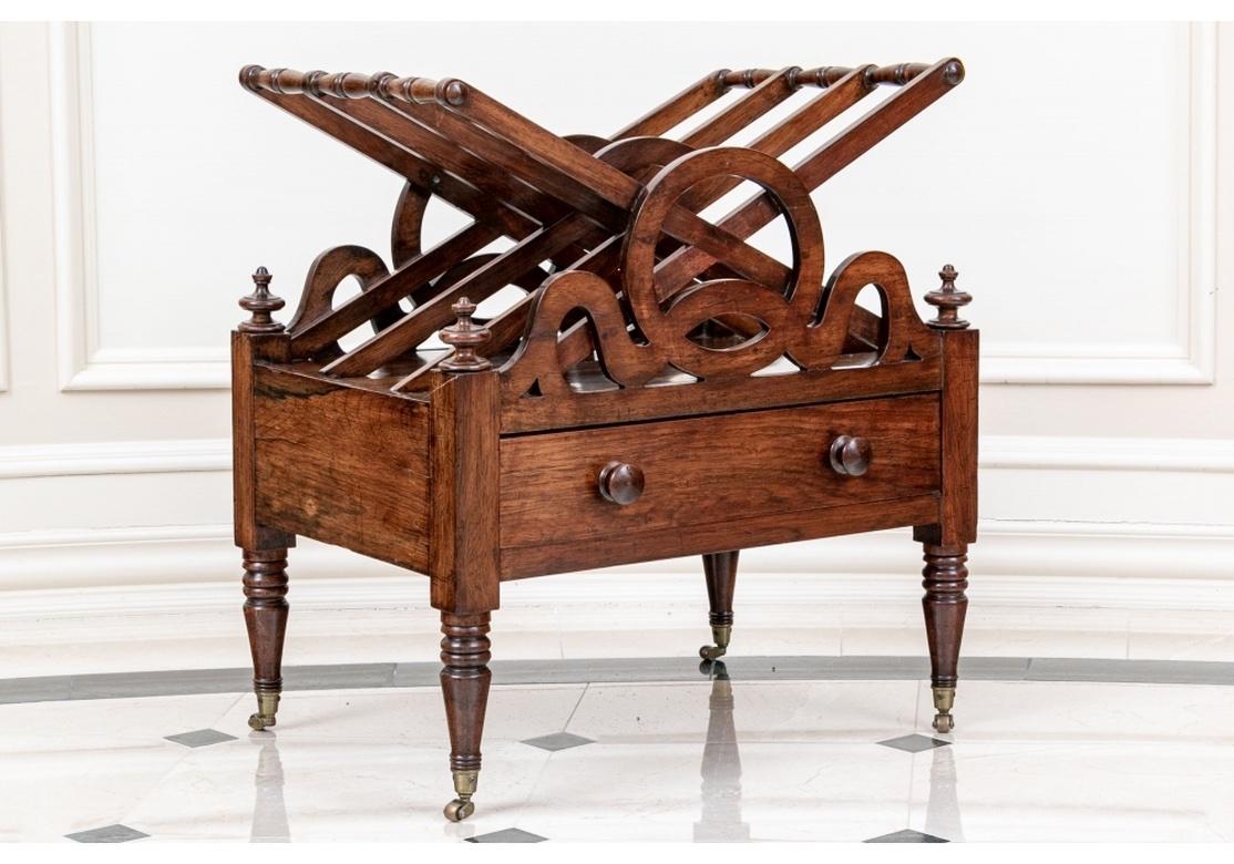 Provenance: Christies. In an elaborate unusual form with three tall flat X form slots, exquisitely fine Dove-Tail joins on the drawers and carved openwork front and back with circles flanked by scrolls. The case with turned finials, and an apron