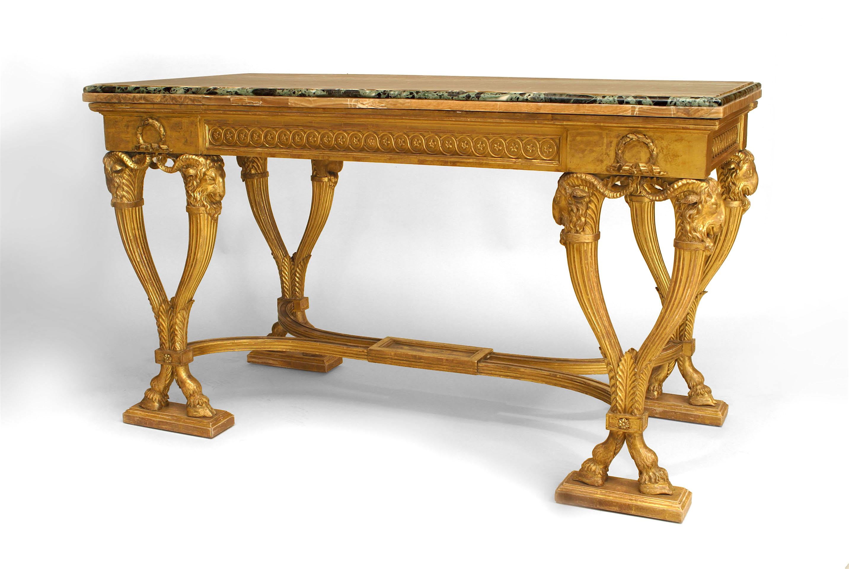 English Adam (circa 1780) gilt wood console with a carved frieze over rams head topped fluted legs with a stretcher & alabaster veneered marble top with a verde edge.
