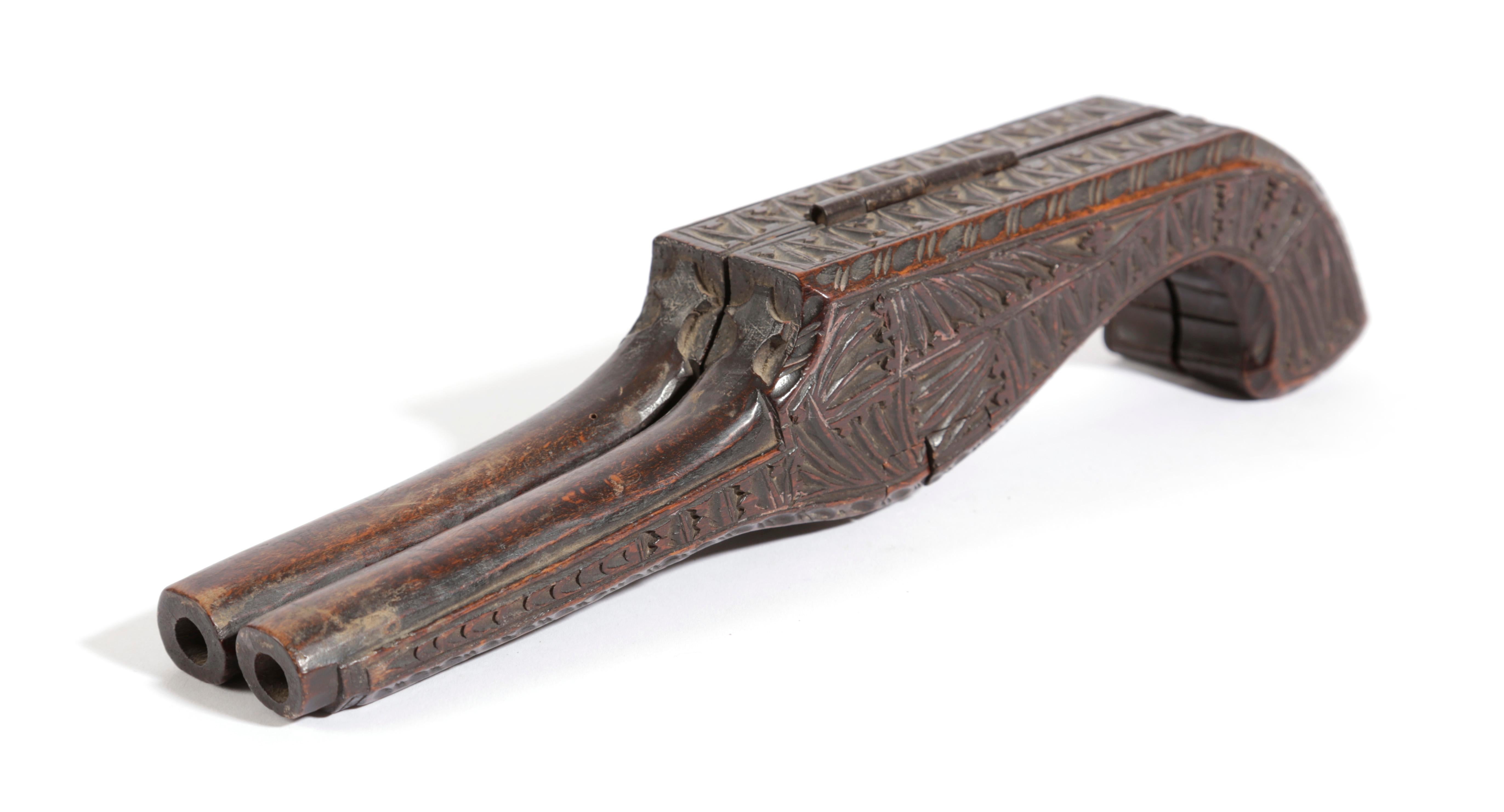 A fine and rare !9th Century hand carved antique treen bootjack, to remove riding boots,  in the unusual form of a pistol.

This is a rare find and unfolds to form a bootjack with beautifully carved to all faces..