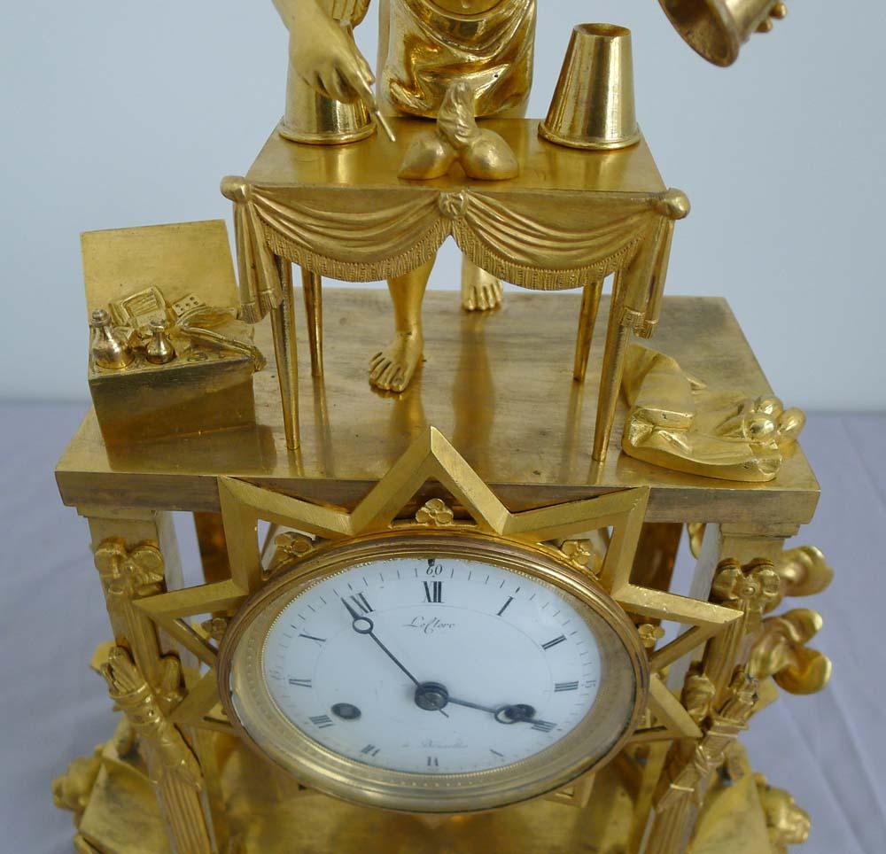Fine and Rare French Empire Clock of Cupid as Magician Uncovering Flaming Hearts In Good Condition For Sale In London, GB