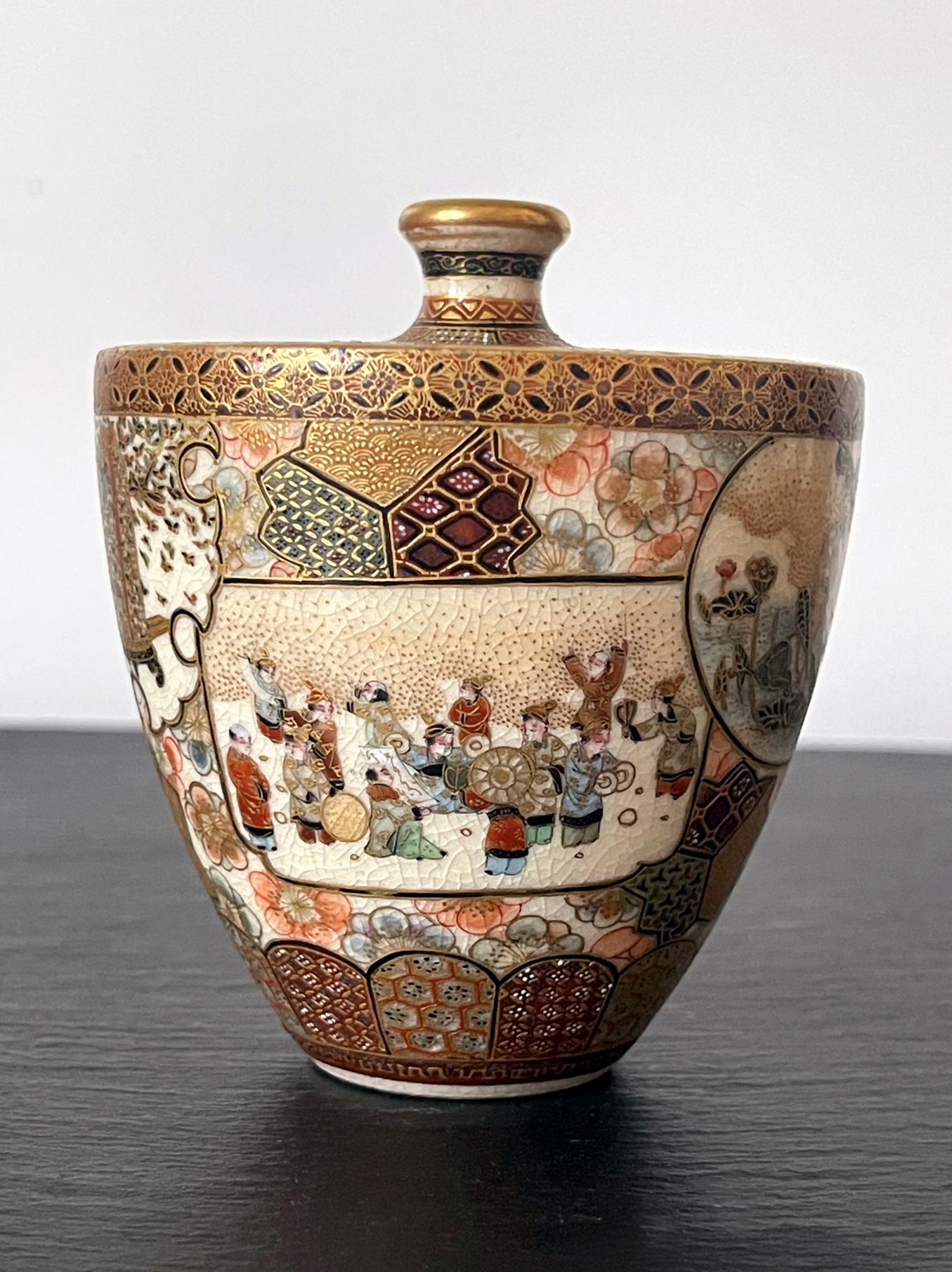 A very fine miniature ceramic vase in satsuma ware by Taizan Yohei (1864-1922) circa 1880-1890s of late Meiji period. The vase with a broad flat shoulder was lavishly decorated with colored enamels in merticulous details. On the background of mixed