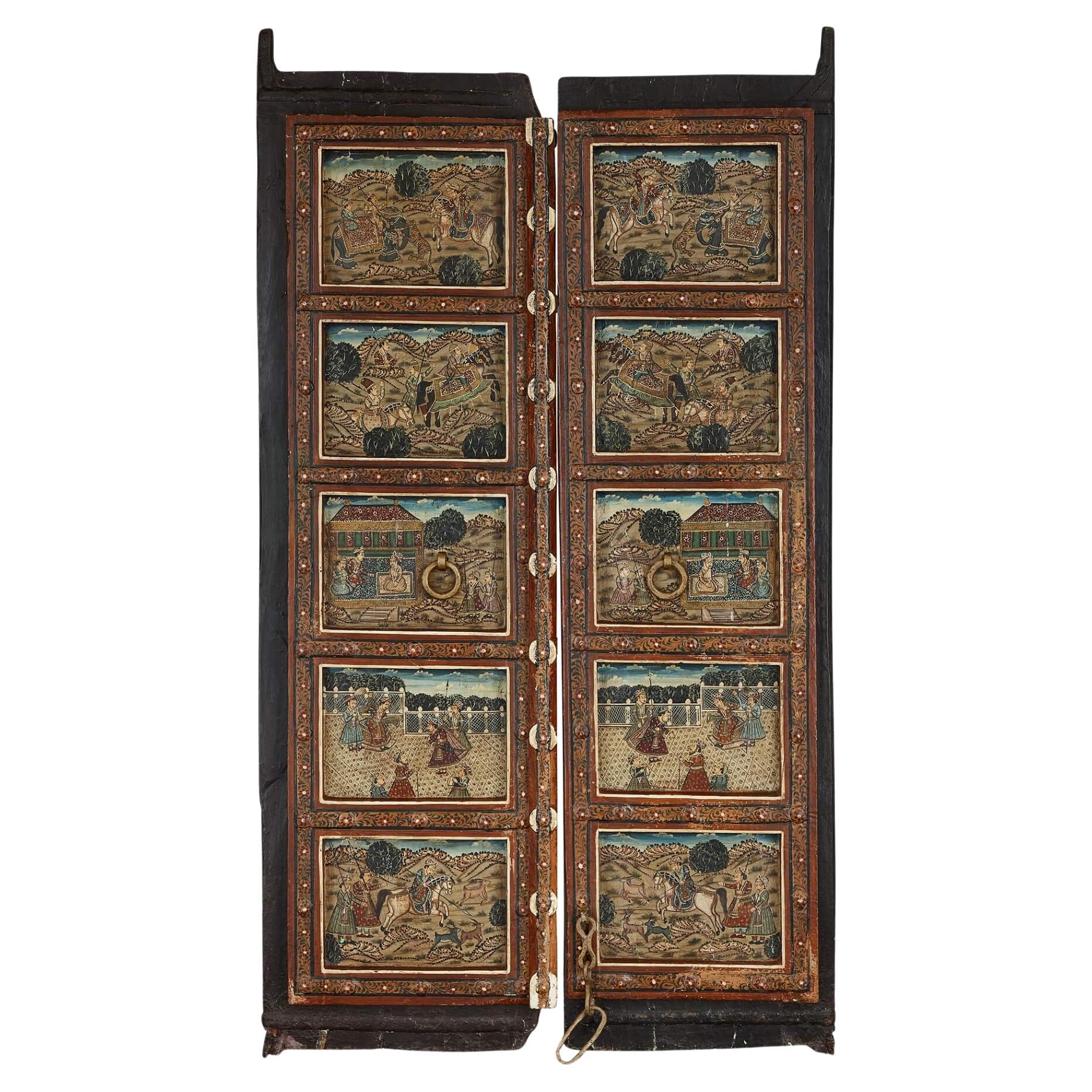 Pair of Indian wooden doors with painted decoration