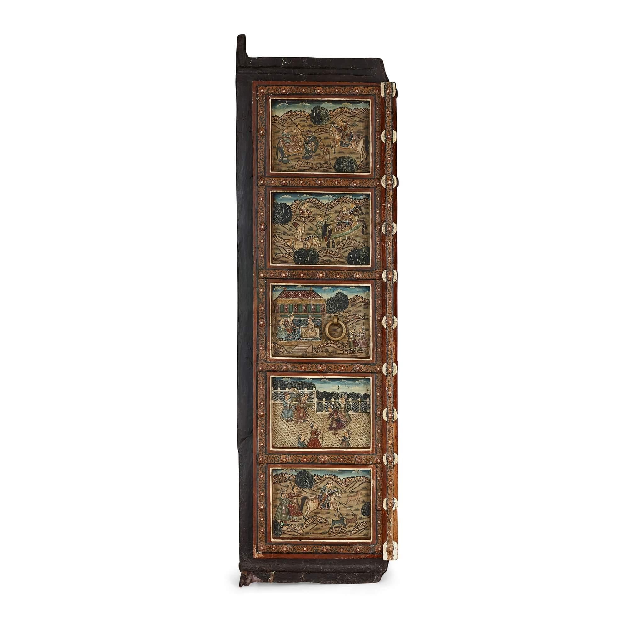 Pair of Indian wooden doors with painted decoration
Indian, 19th Century
Height 165cm, width side-by-side 96cm, depth 10cm

This pair of wooden doors is painted with a host of superb Indian imagery. The doors feature wrought iron fixtures, and each