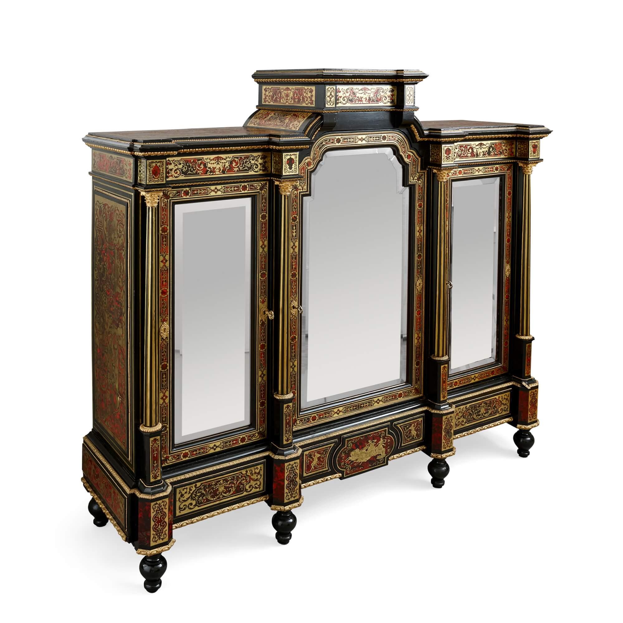 Fine and Unusual Napoleon III period antique French Boulle marquetry cabinet
French, c.1870
Height 165cm, width 174cm, depth 51cm

This piece is a splendid, ebonised wood antique cabinet decorated with Boulle inlay and ormolu mounts, formed with