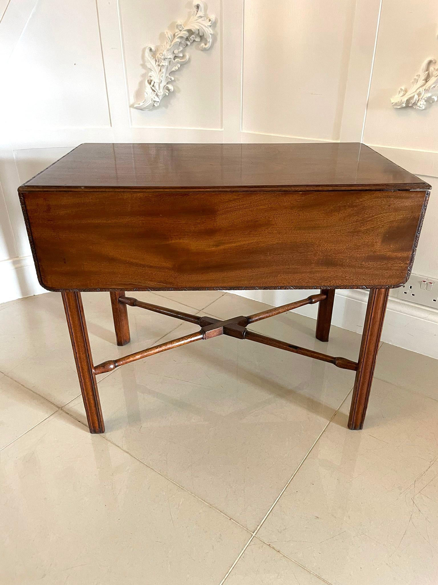 Fine antique 18th century Thomas Chippendale childs mahogany Pembroke table having twin flaps that boast rounded corners and splendid carved edges above a single frieze drawer with original brass handle. It is raised on moulded square chamfered legs