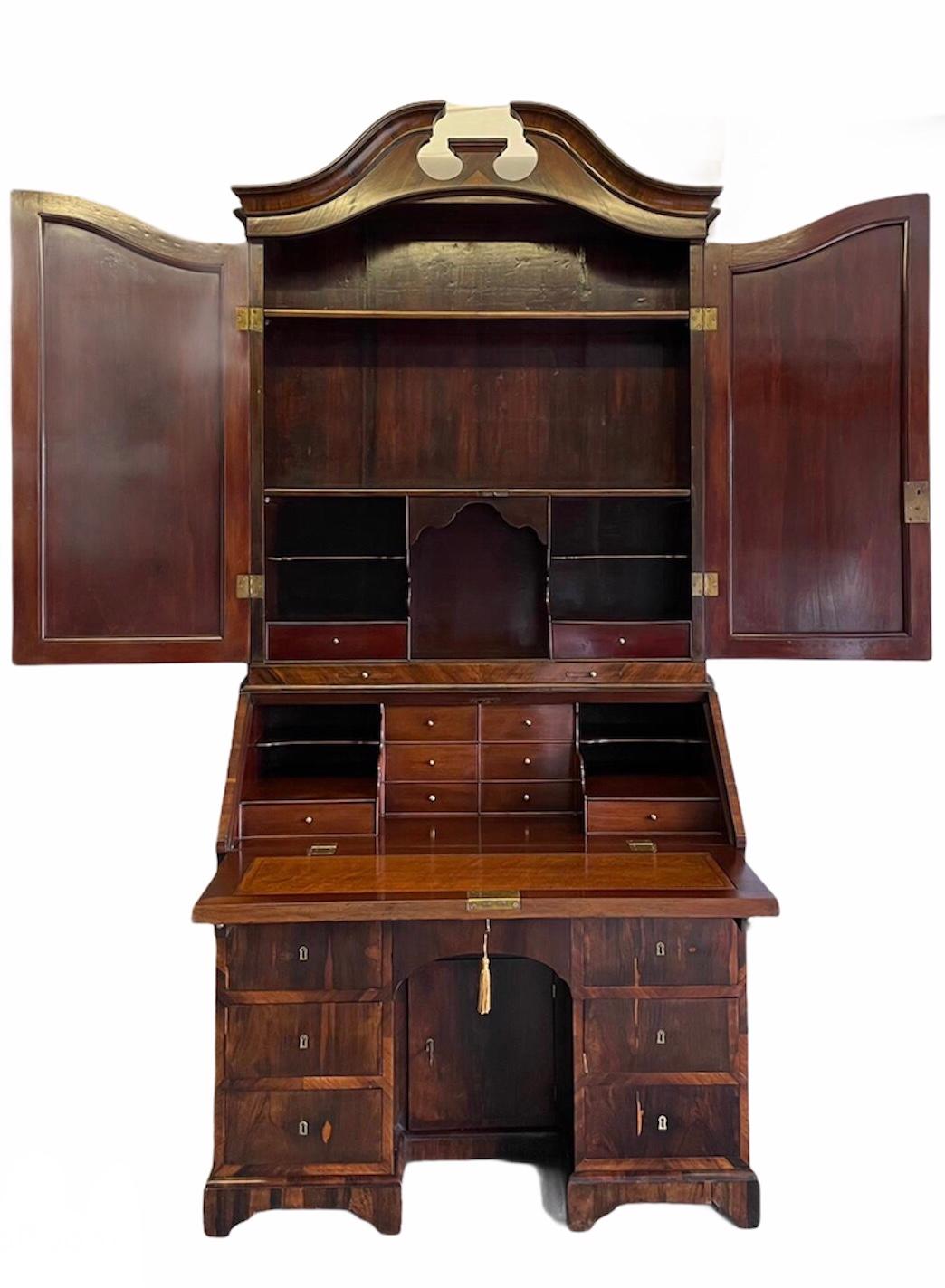 Fine antique 18th century rosewood bureau bookcase having a magnificent top section with a shaped moulded swan neck pediment, two shaped doors both with original mirrors which open to reveal the most superior quality fitted interior of drawers,
