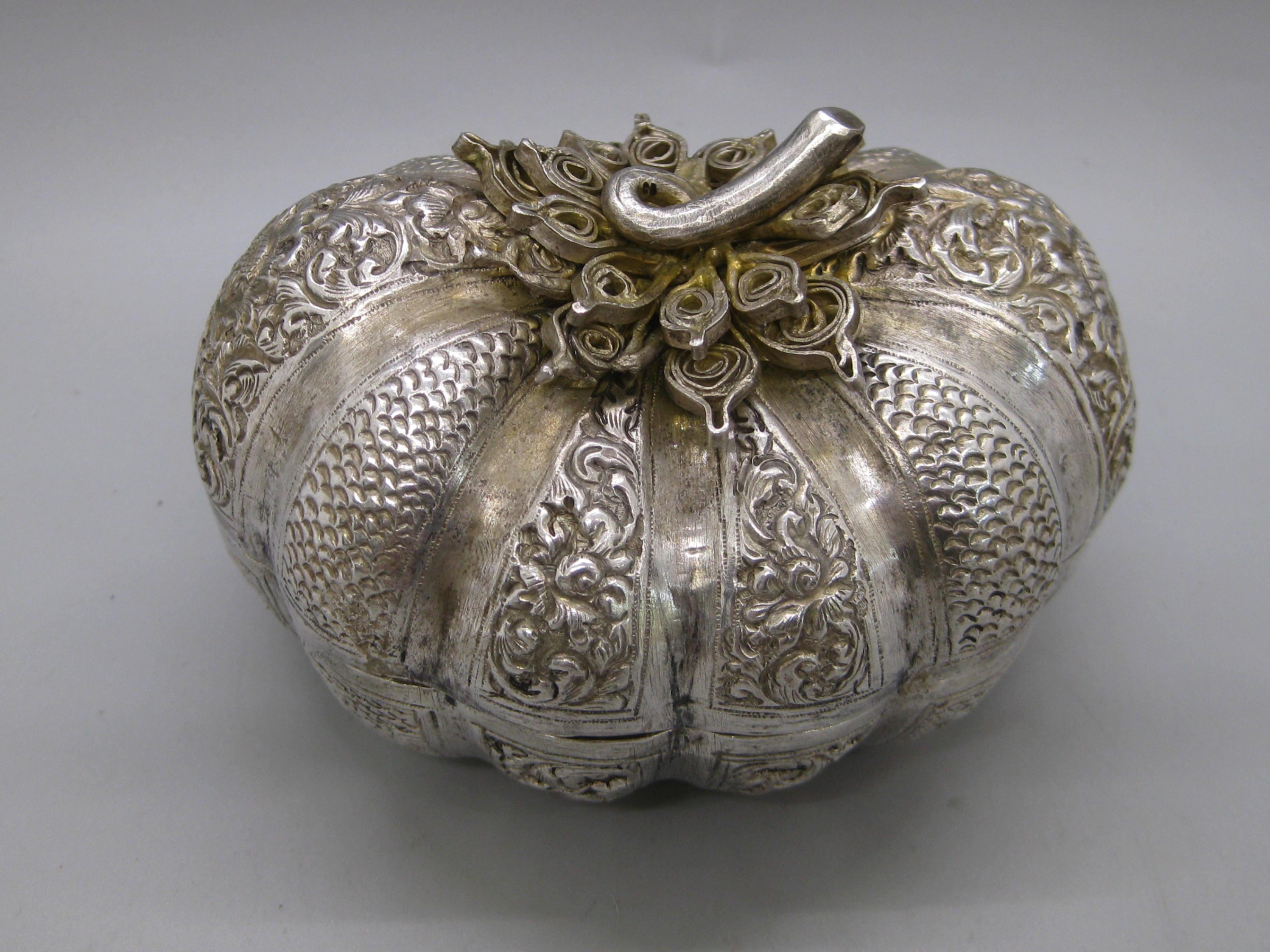 Fine antique 19th century Malaysia Southeast Asia .900 silver box in the form of a pumpkin. Wonderful shape and form. Has repousse relief around the box. Opens and closes as it should. Great detail and is a high quality piece. Measures approx. 3