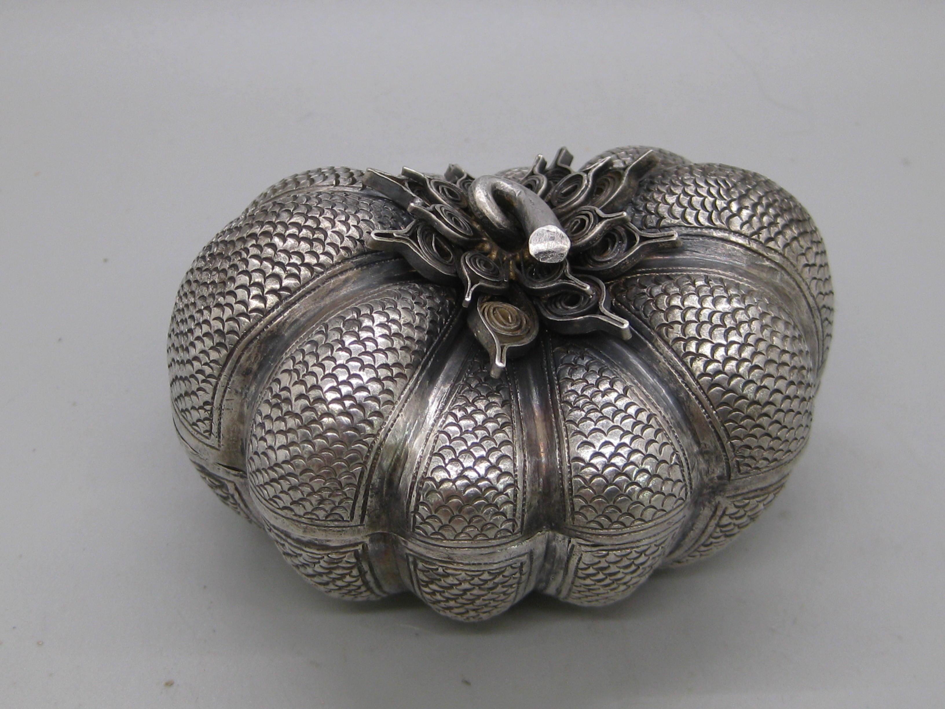 Fine antique 19th century Malaysia Southeast Asia .900 silver box in the form of a pumpkin. Wonderful shape and form. Has repousse relief around the box. Opens and closes as it should. Great detail and is a high quality piece. Measures approx. 3