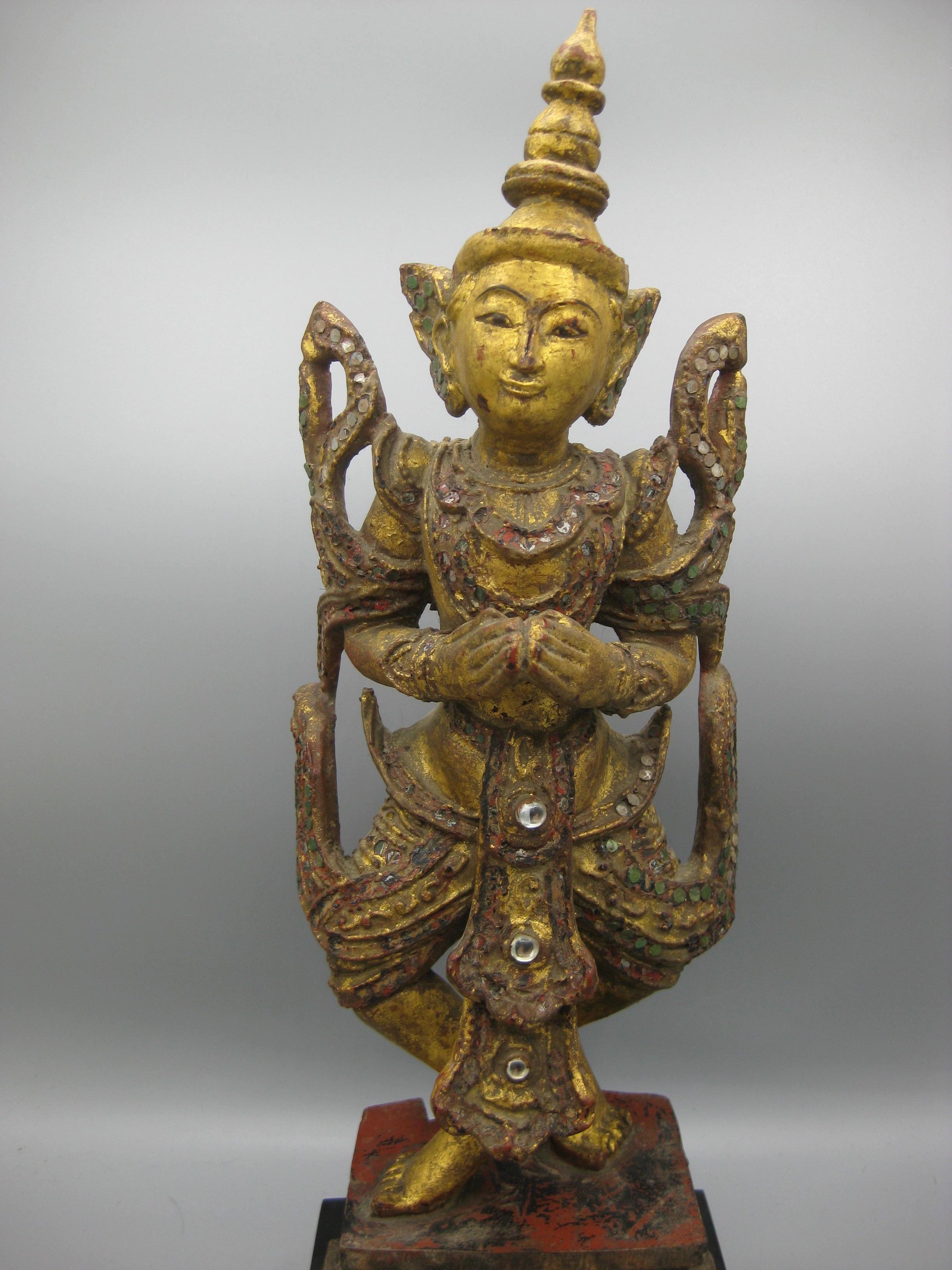 Fine antique 19th century Thailand. deity temple goddess hand carved wood statue. Wonderful shape and form. Has inlaid glass pieces for decoration. The wooden statue has gold gilded paint over red lacquer. Great detail and is a high quality piece.