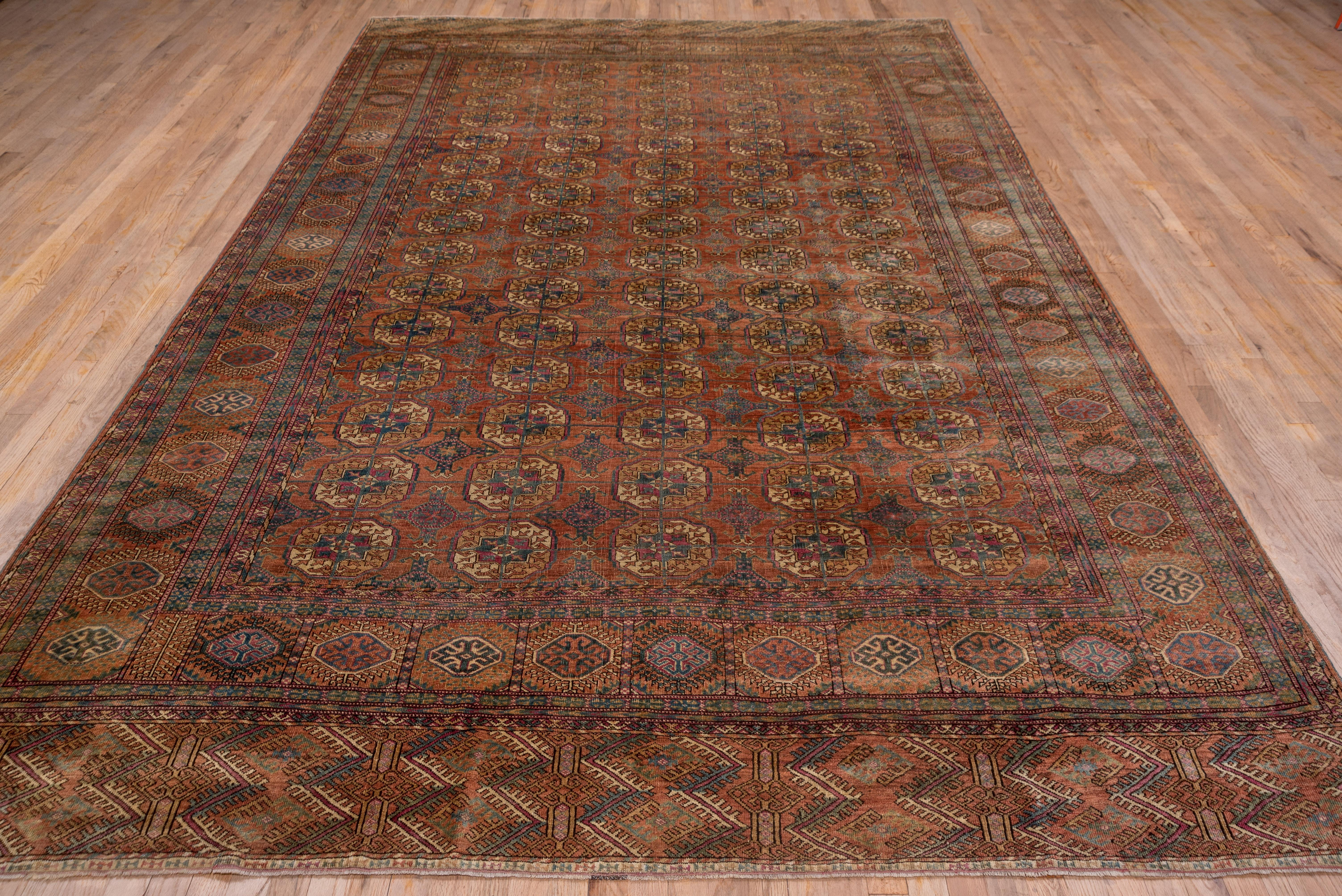 Tribal Fine Antique Afghan Bokara Rug, Red & Rust Allover Field, Blue Accents For Sale
