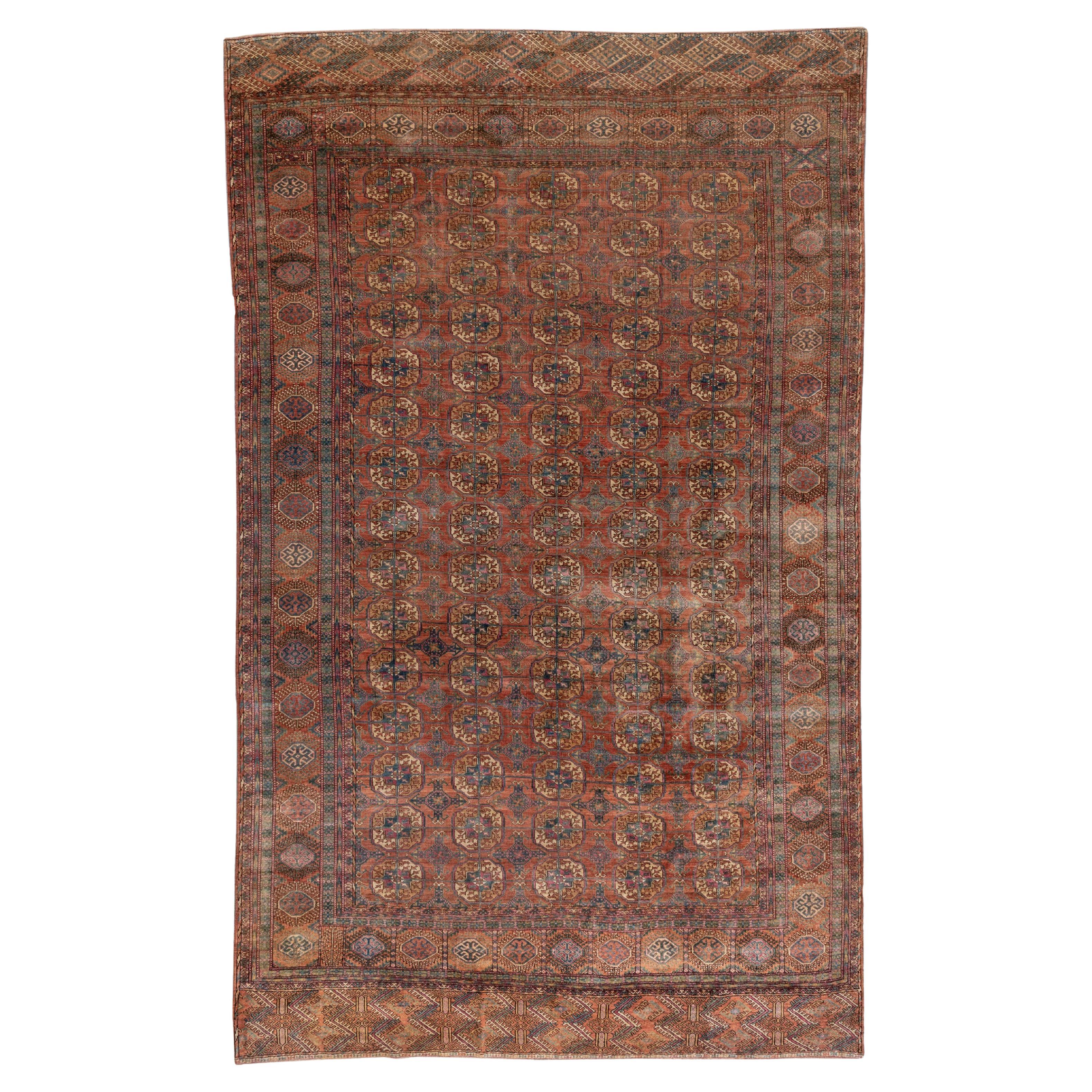 Fine Antique Afghan Bokara Rug, Red & Rust Allover Field, Blue Accents For Sale