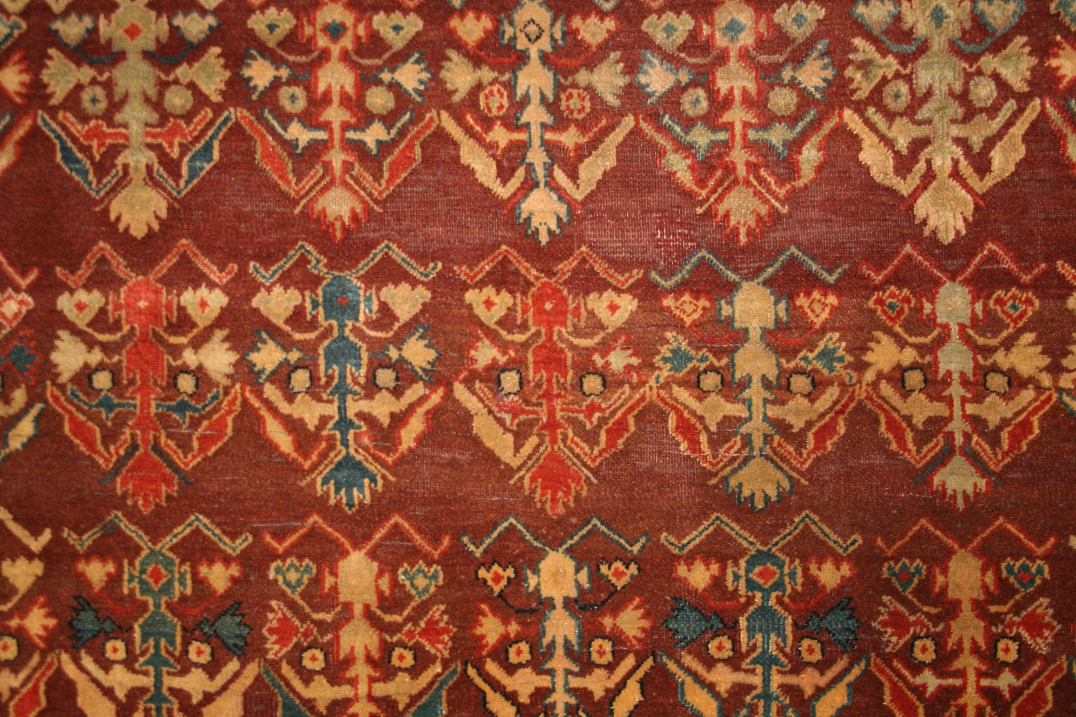 Hand-Knotted Fine Antique Agra Rug with All-Over Shrub Pattern on a Maroon Background For Sale