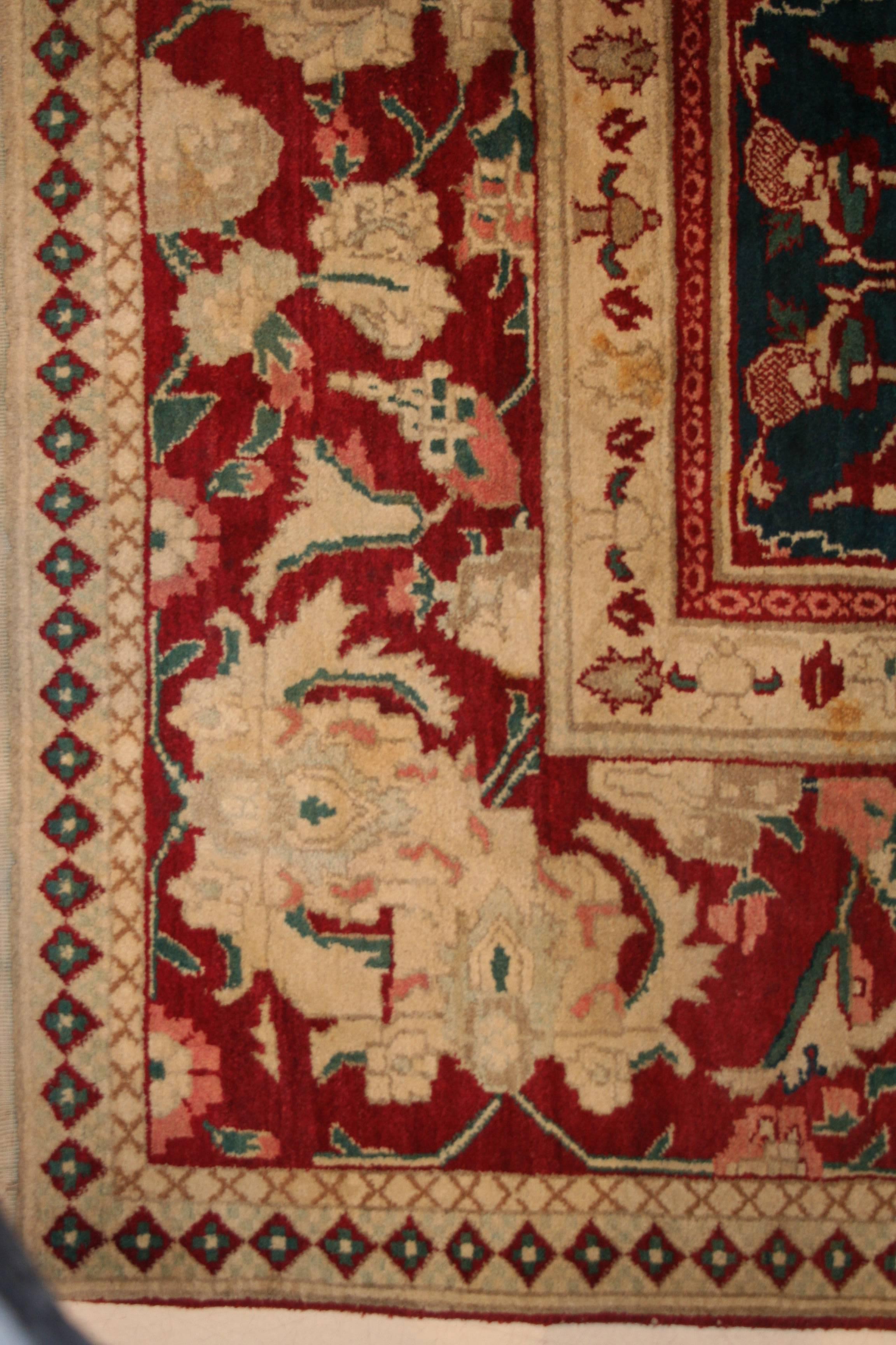Agra carpets have historically been regarded among the most refined decorative carpets. They were commissioned by British nobility during the colonial period to adorn their castles and palaces. This finely woven example, in excellent condition, is
