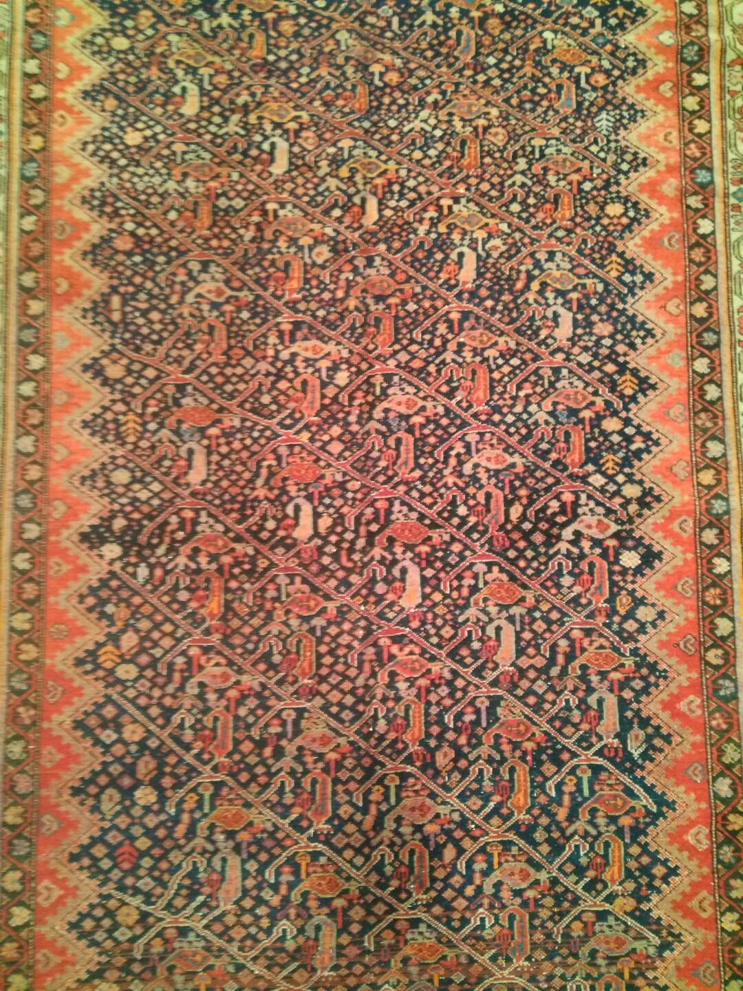 Known in the old rug literature as ‘Gentleman’s carpets’, Qarabagh long rugs such as this one represent a classic late nineteenth century type which became quite popular in the West, especially because of its traditional kelleh format, in which the