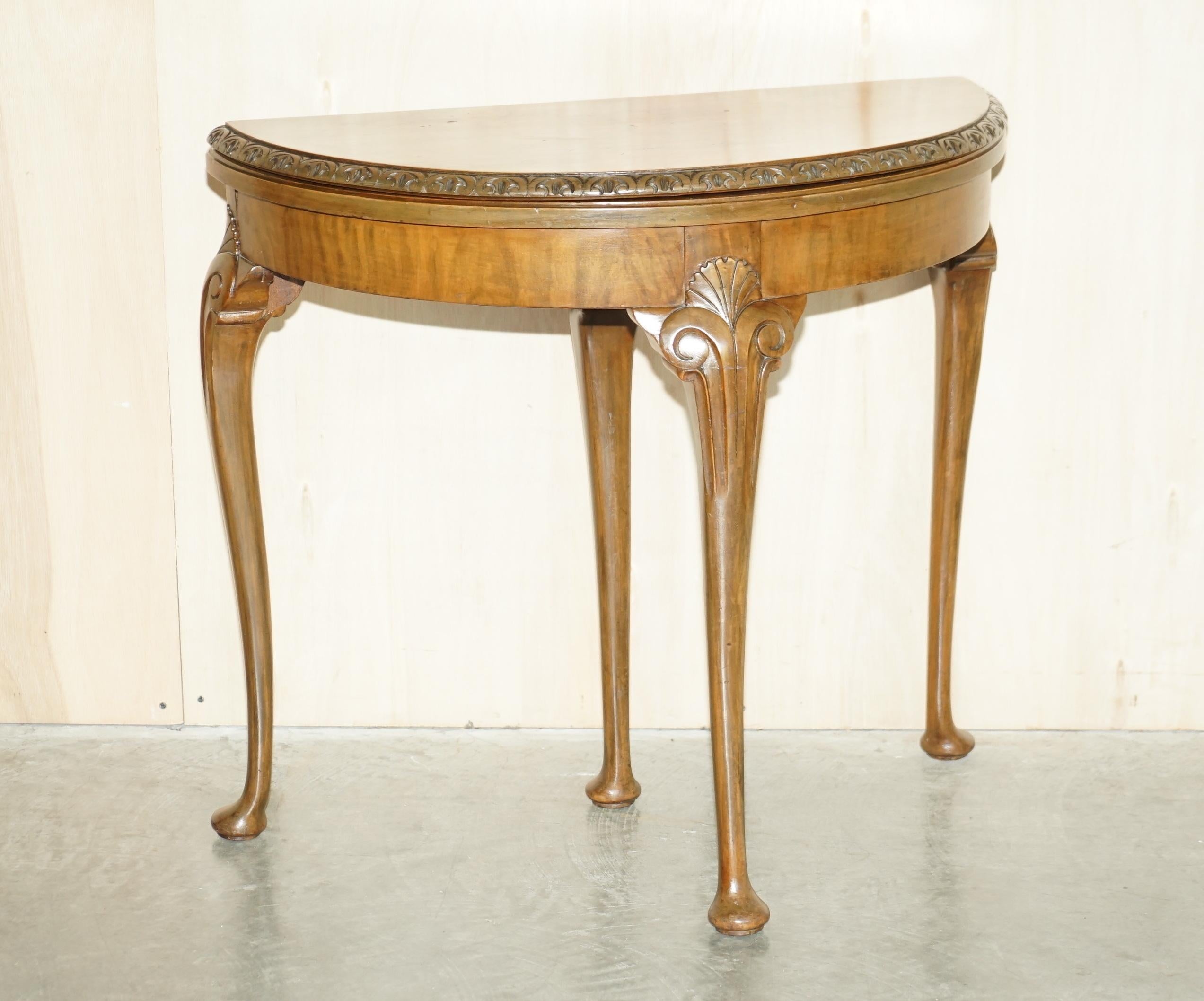 We are delighted to offer for sale this lovely circa 1880-1900 burr walnut demi lune games card table with ornately carved legs

A very good looking and well made piece, made in the Regency style however it is late Victorian. The legs are