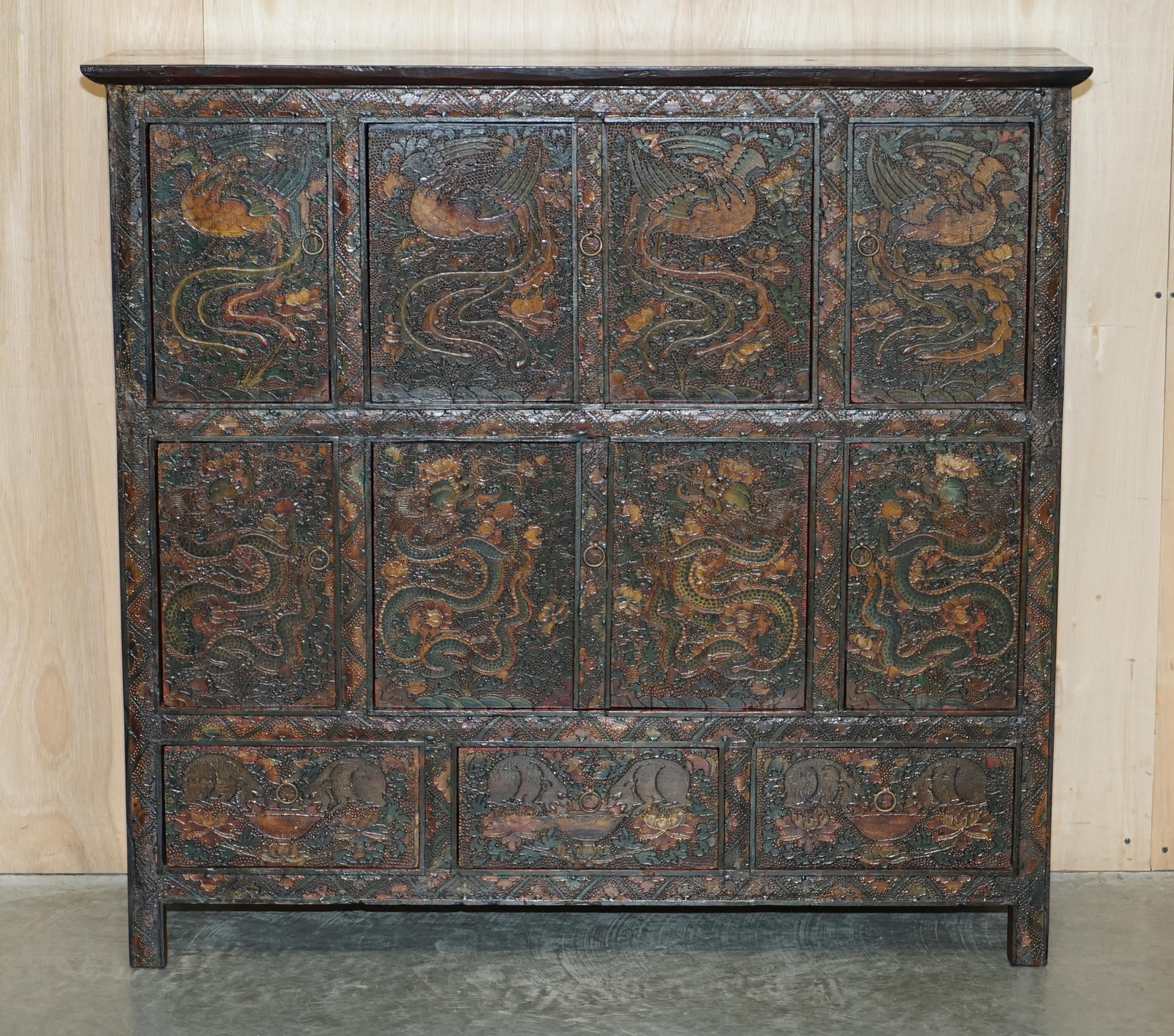 We are delighted to offer for sale this absolutely stunning, highly decorative, Antique Tibetan, Polychrome painted Altar cabinet with drawers depicting dragons

This is a very good looking and well made piece of art furniture. It is the best kind