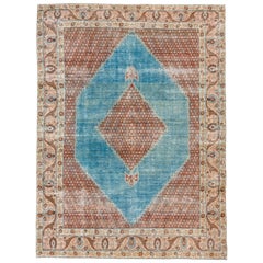 Fine tapis Tabriz ancien coloré, champ intérieur bleu, champ extérieur à fleurs rouges